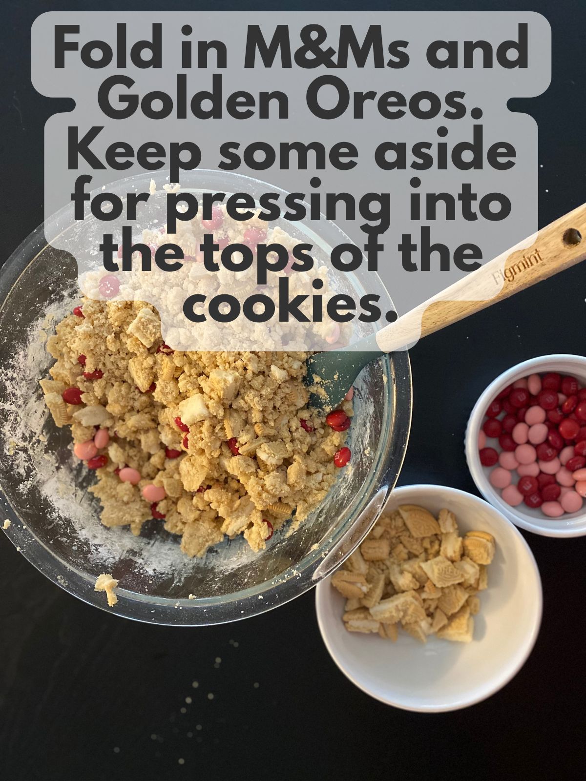 cookie dough with M&Ms and chopped Oreos folded in with extra M&Ms and Oreos on the side