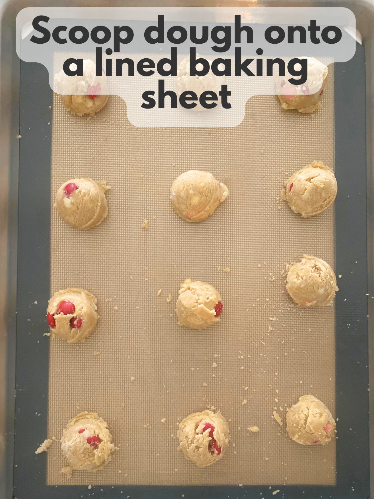 cookie dough balls on a baking sheet