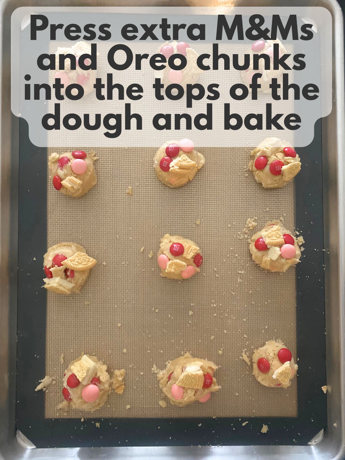 cookie dough balls with extra M&Ms and Oreos pressed in the top