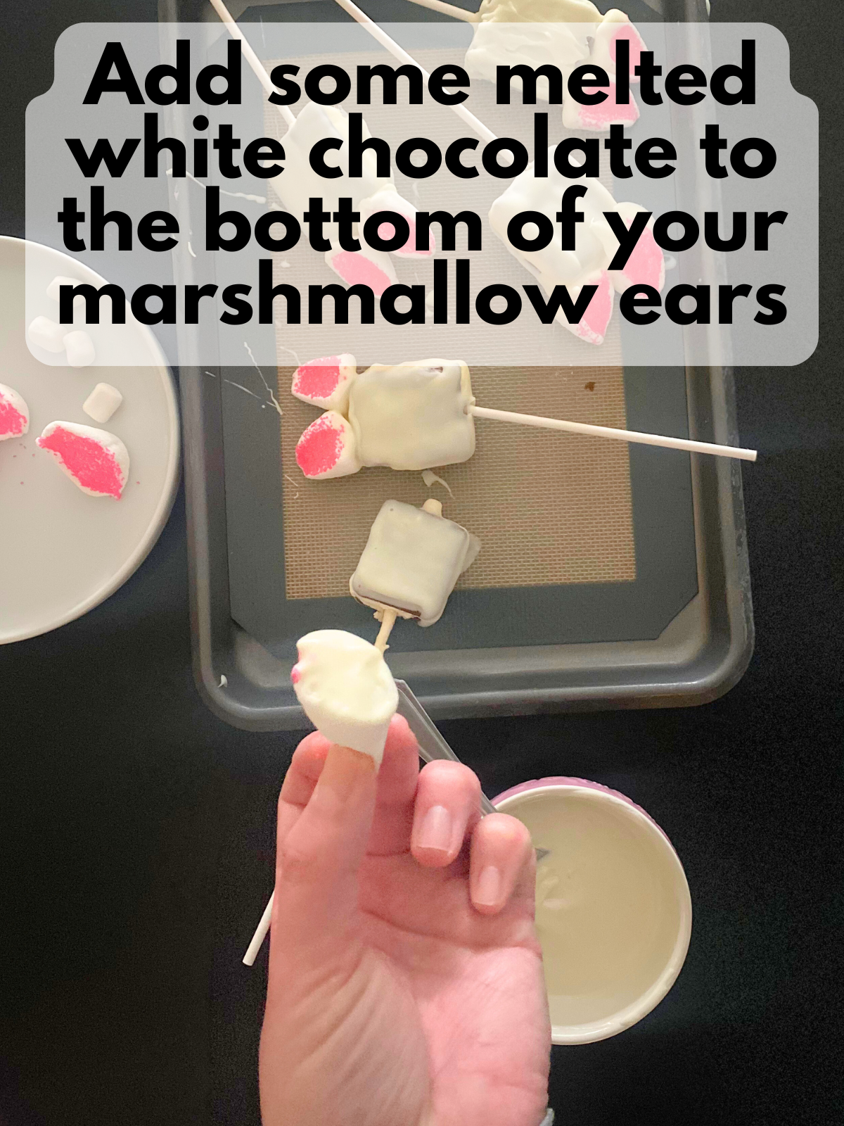 melted white chocolate on the bottom of a marshmallow