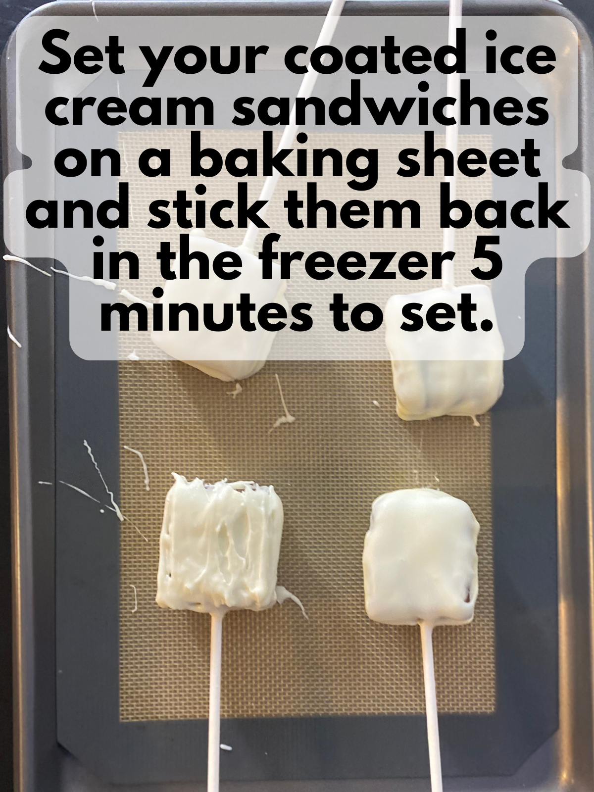 ice cream sandwiches coated in white chocolate on a tray