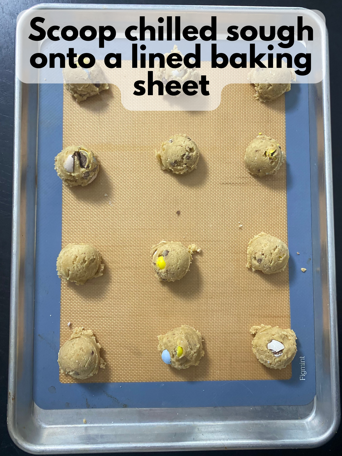 brown butter cookie dough rolled into balls on a baking sheet