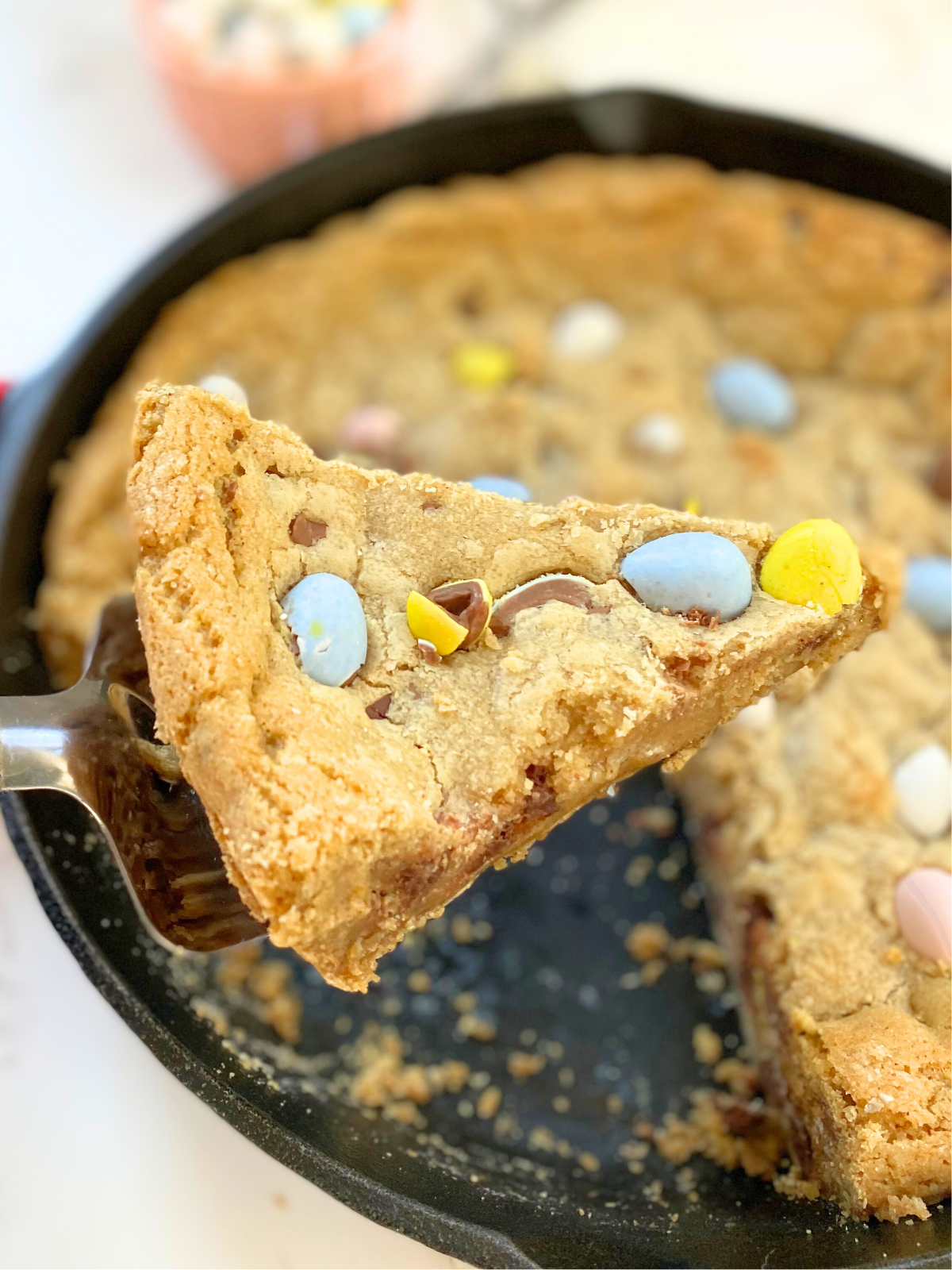 cadbury egg skillet cookie with a slice being taken out