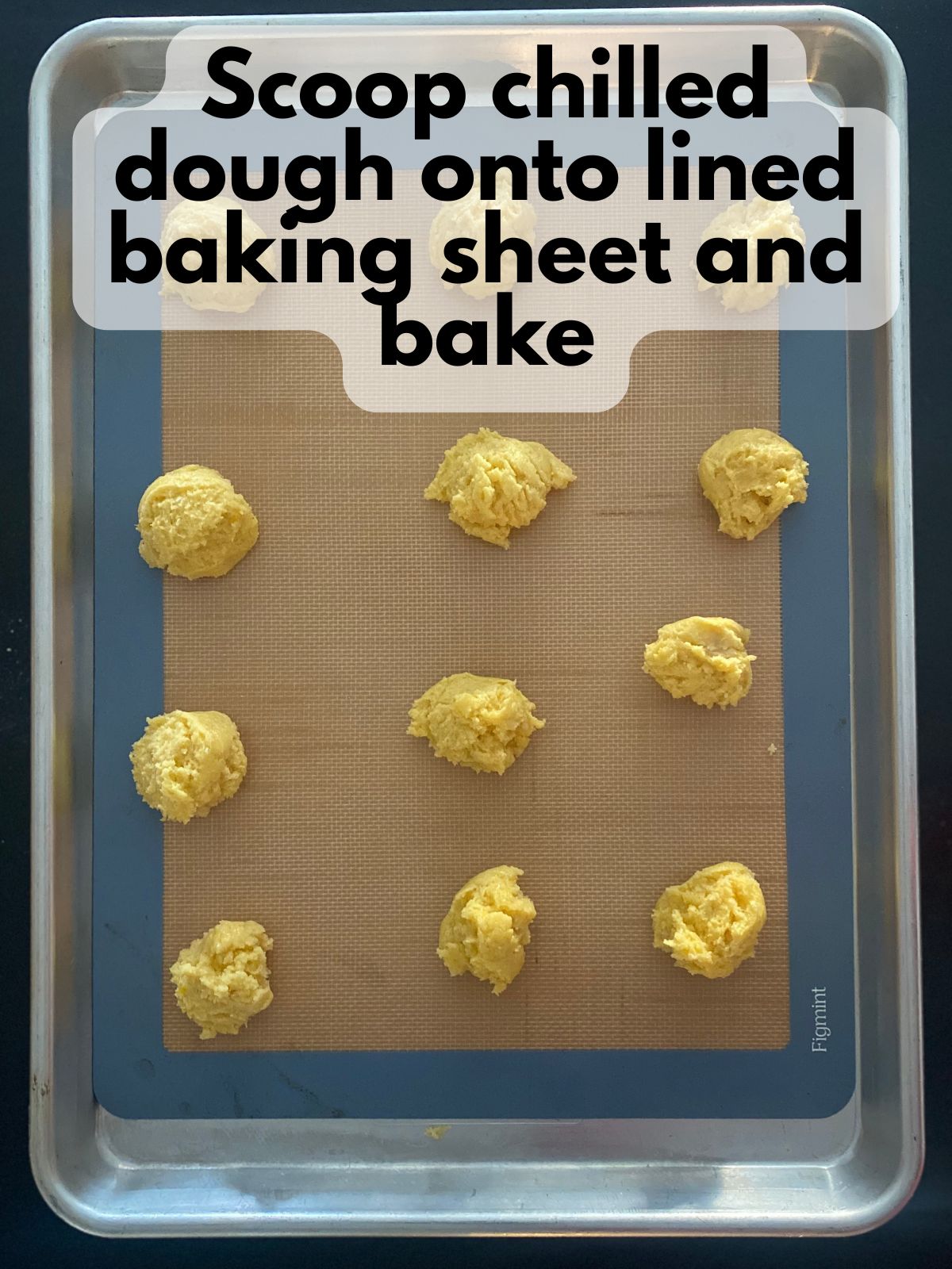 lemon cake mix cookie dough scooped onto a baking sheet