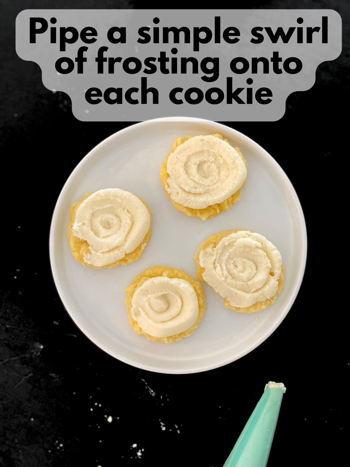 vanilla buttercream piped onto lemon cake mix cookies