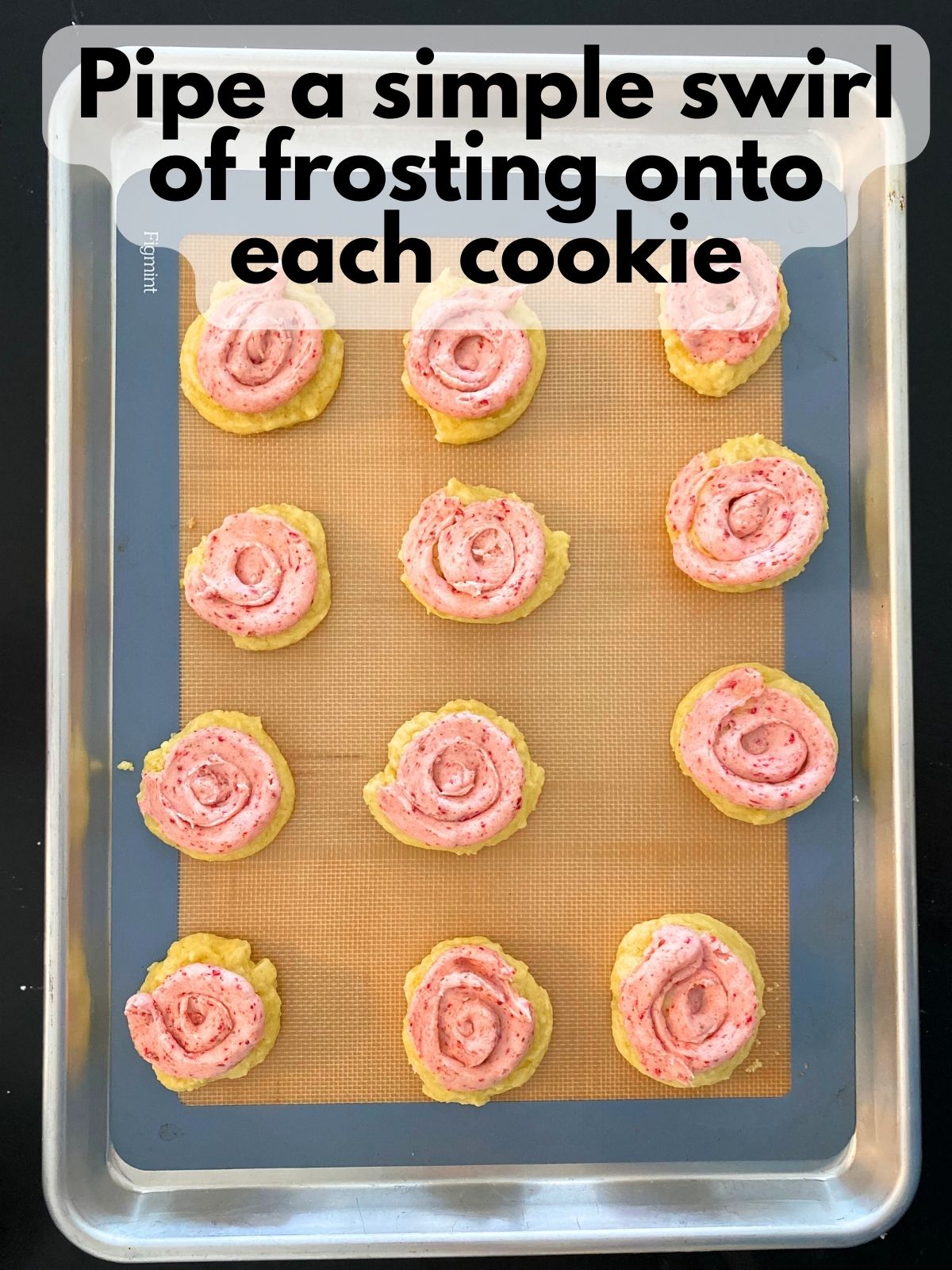 lemon cake mix cookies with strawberry frosting piped on