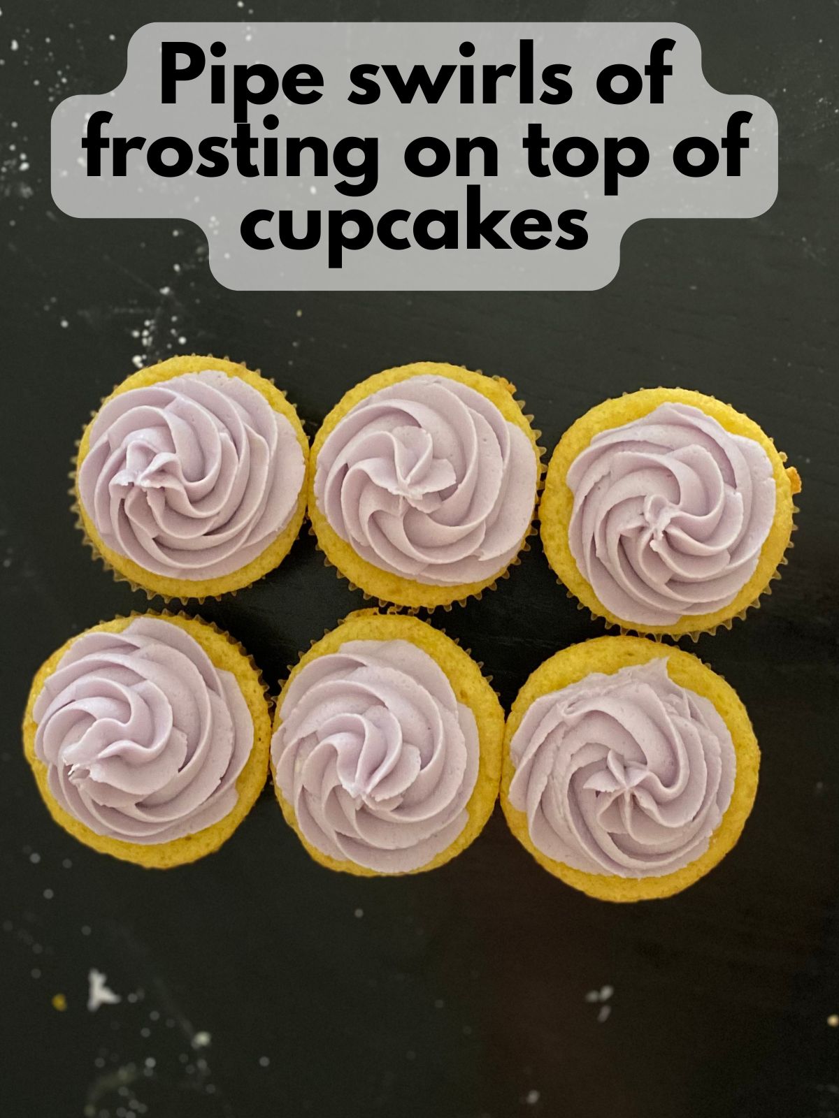 lemon cupcakes with lavender buttercream swirled on top