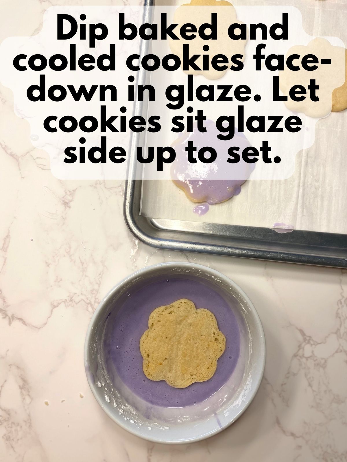 lemon shortbread cookie dipped face-down in lavender glaze