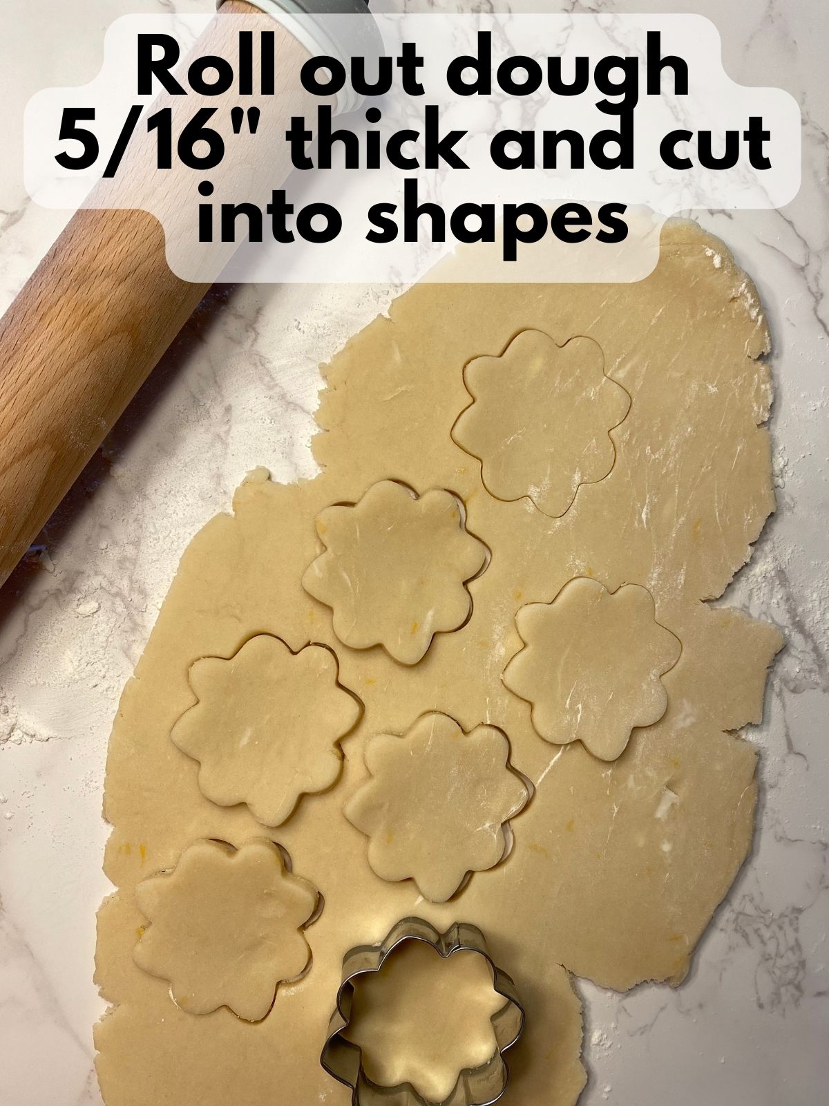 lemon shortbread dough cut into flower shapes