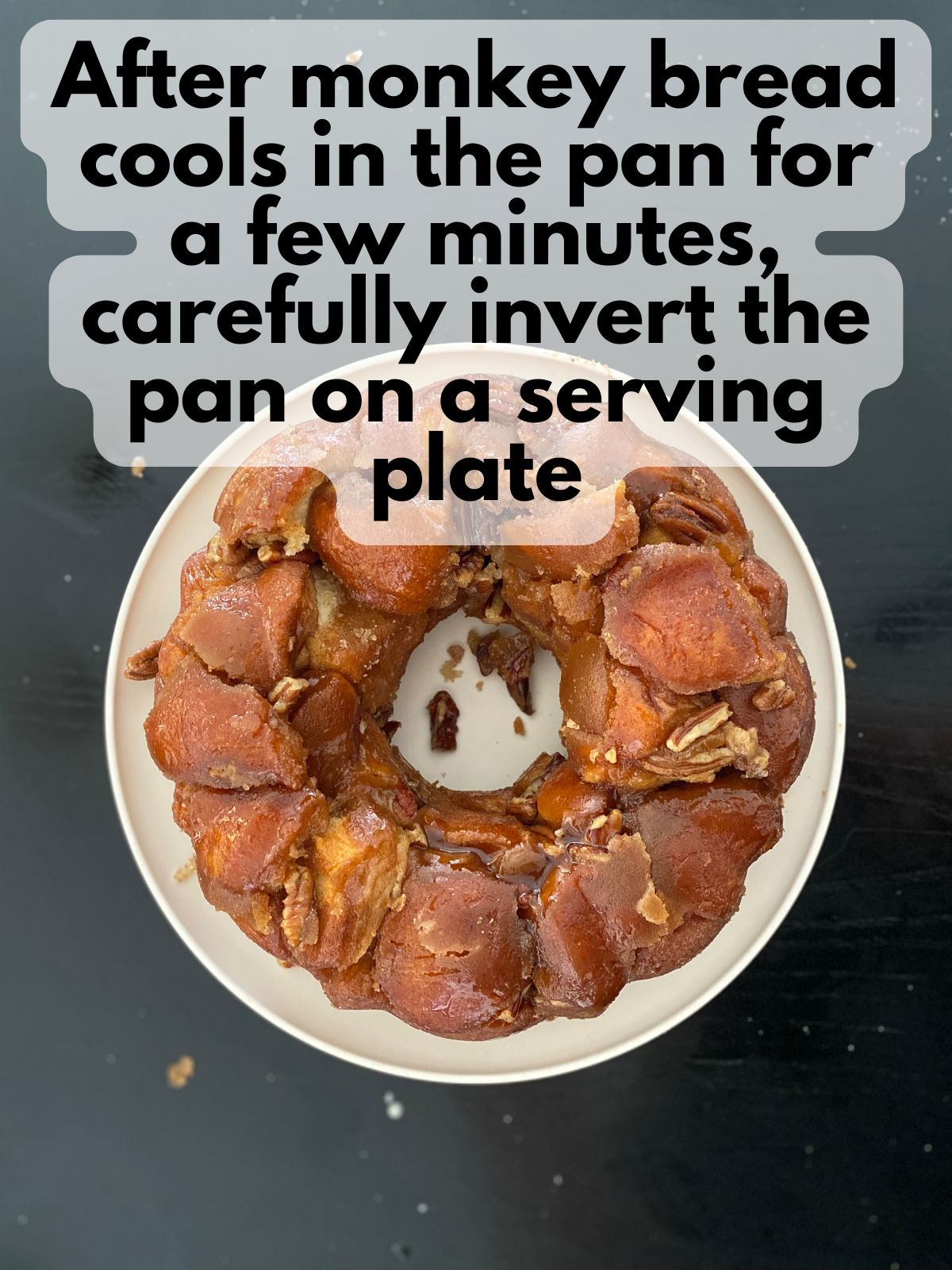 baked monkey bread removed from pan sitting on a plate