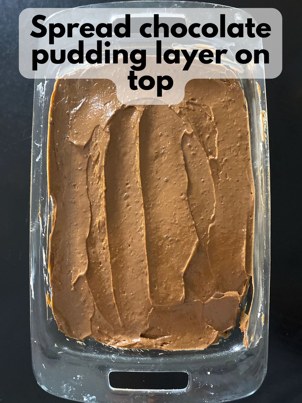 chocolate pudding layer spread on top of cream cheese layer