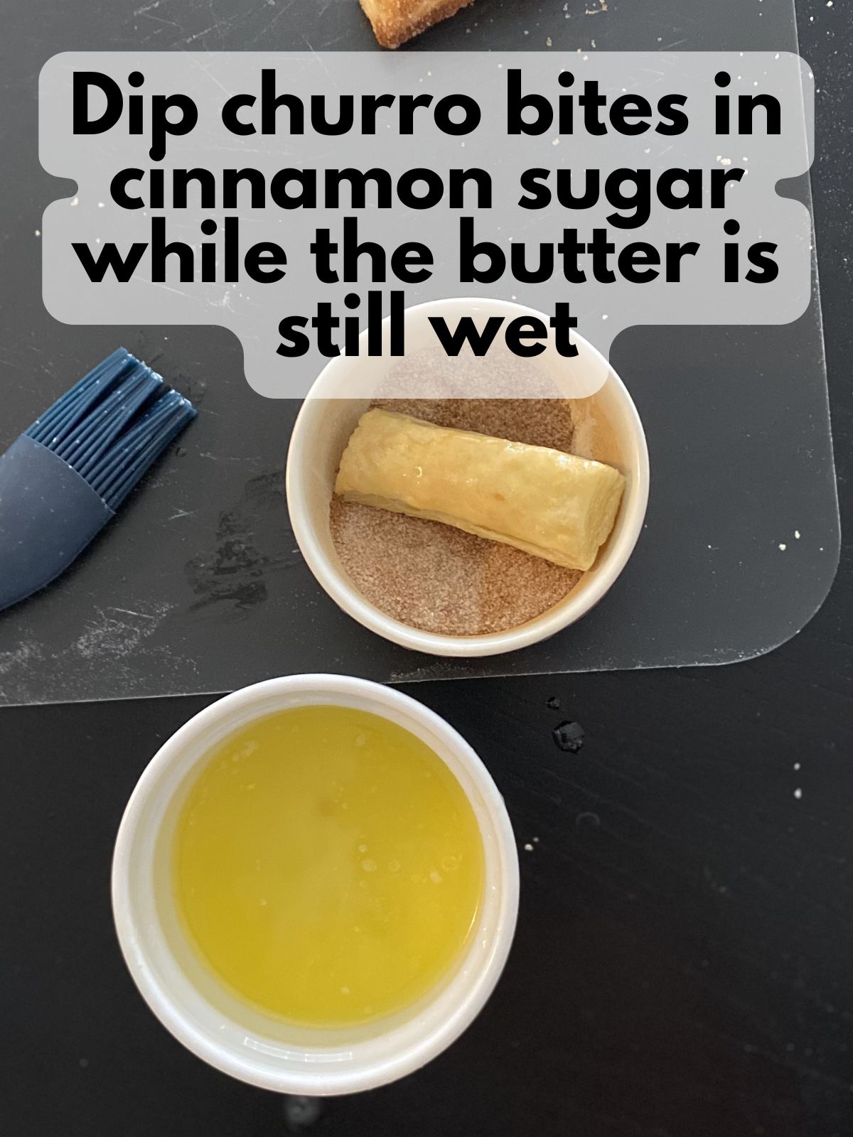 churro bite coated in melted butter and cinnamon sugar