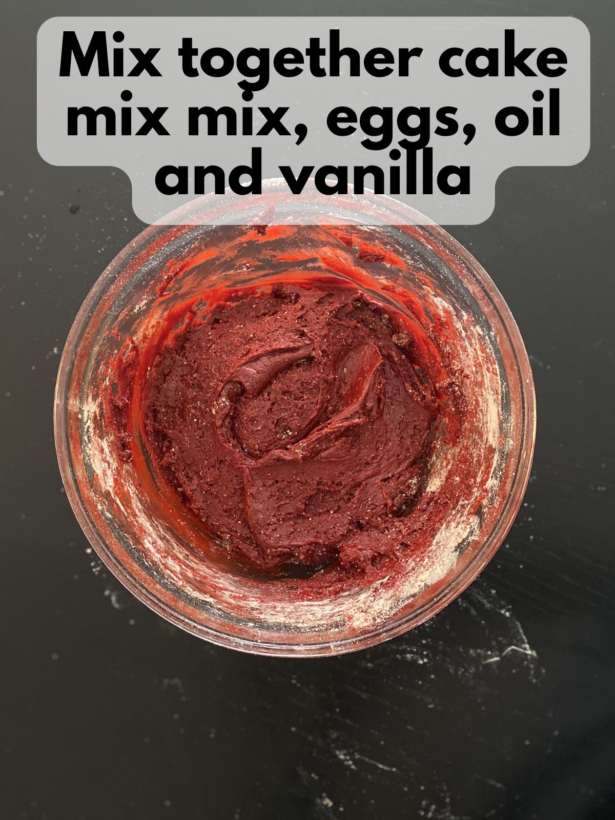 red velvet cake mix cookie dough in a mixing bowl