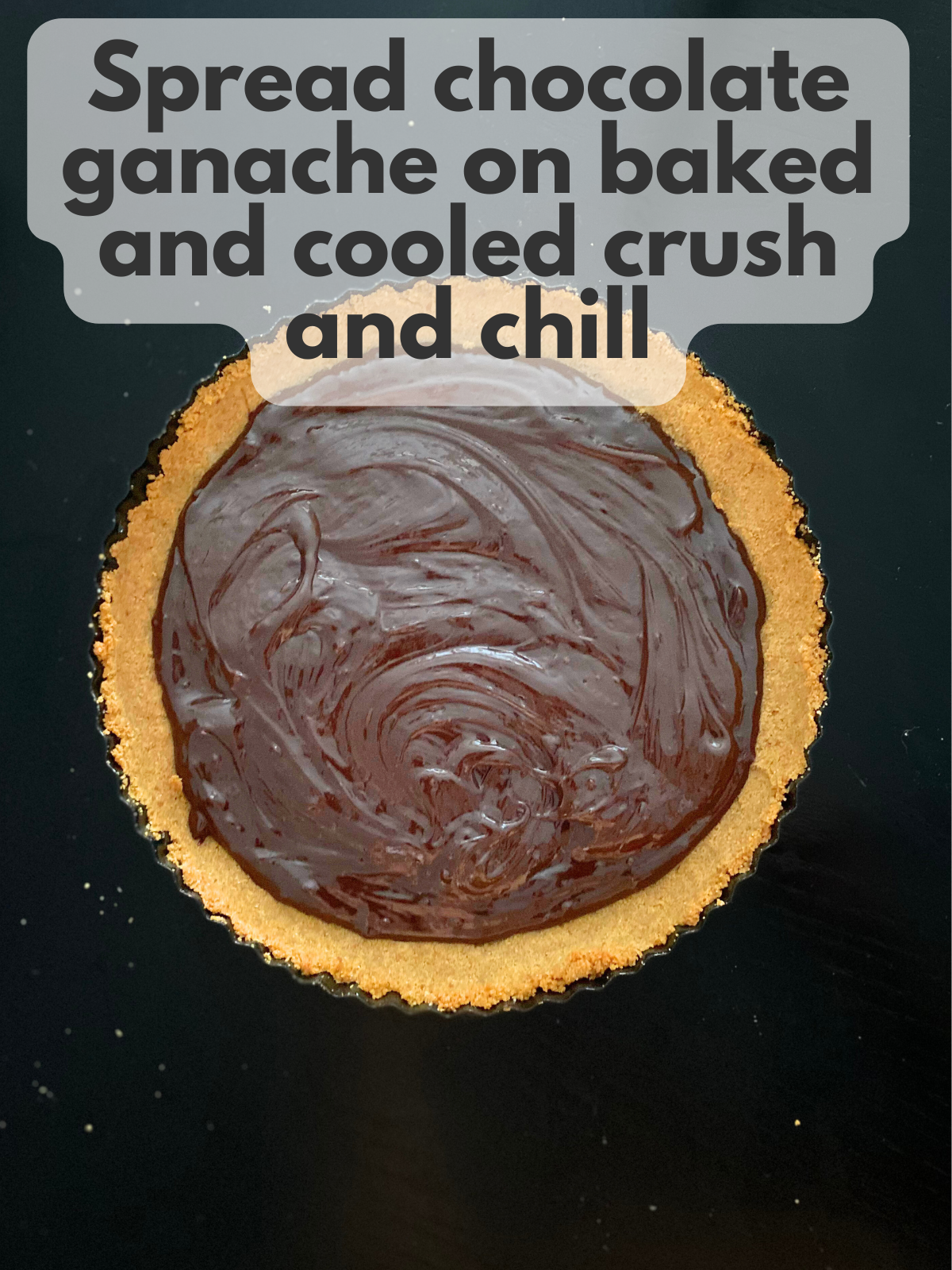 chocolate ganache spread on top of graham cracker crumb crust