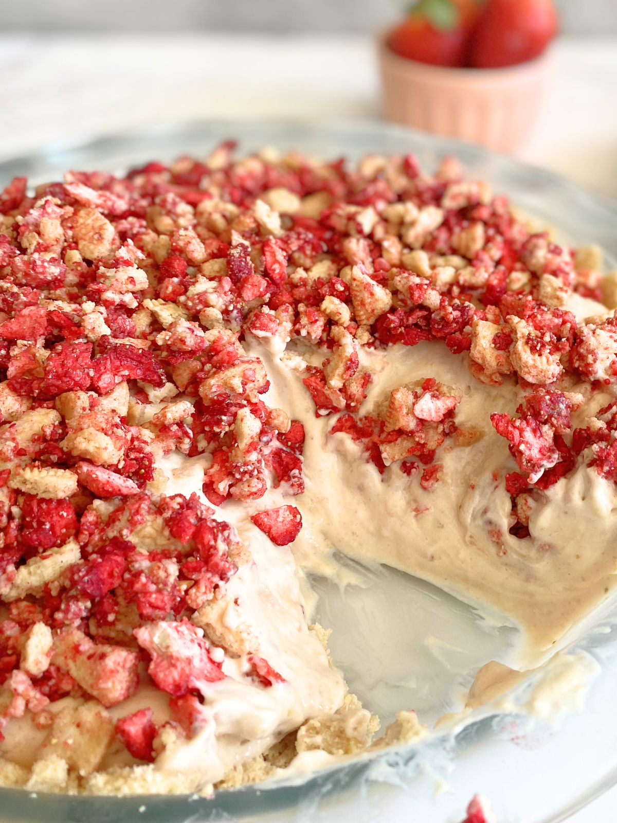 strawberry crunch pie with a slice taken out