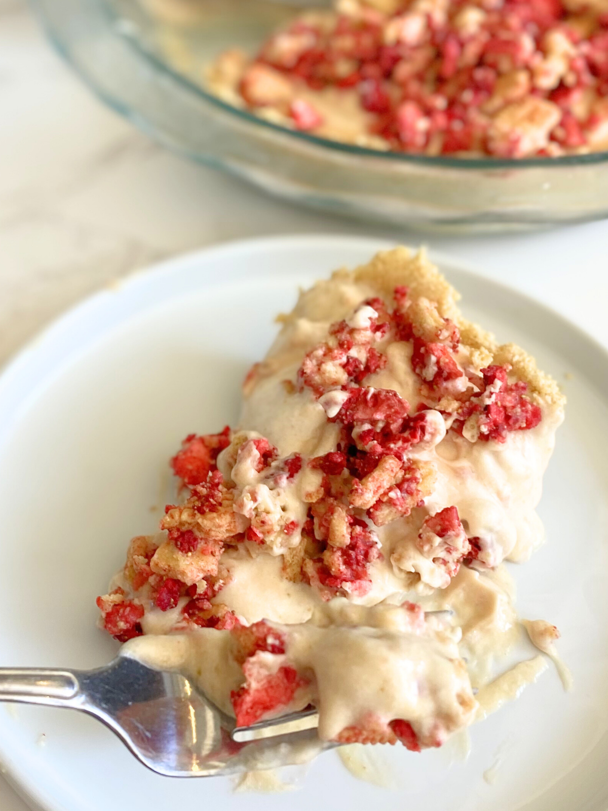 slice of Oreo strawberry crunch pie on a plate
