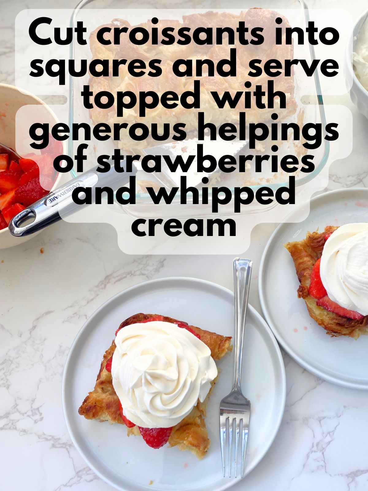 strawberry shortcake croissant bake topped with strawberries and whipped cream
