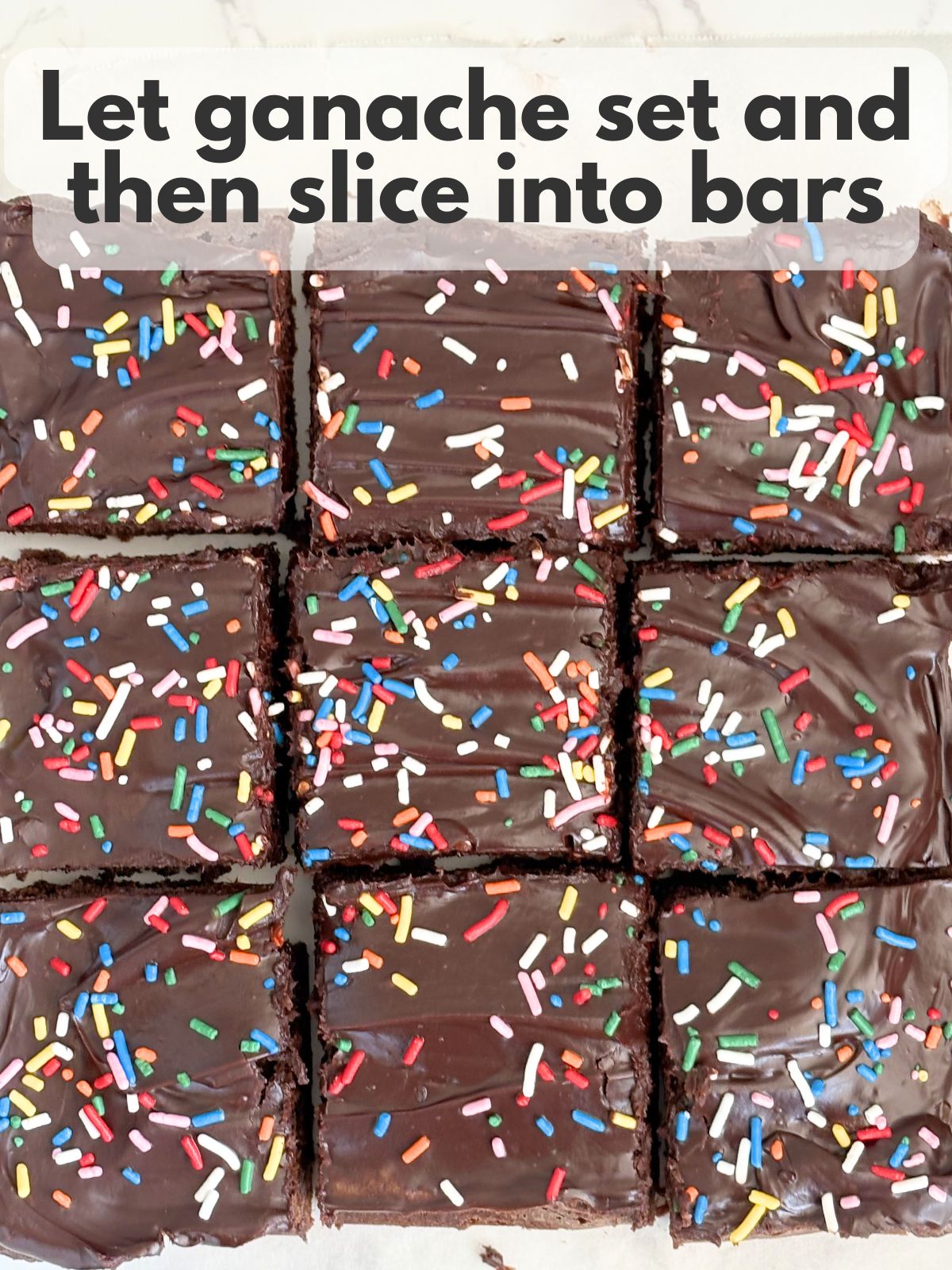 brownies with ganache and sprinkles sliced into squares
