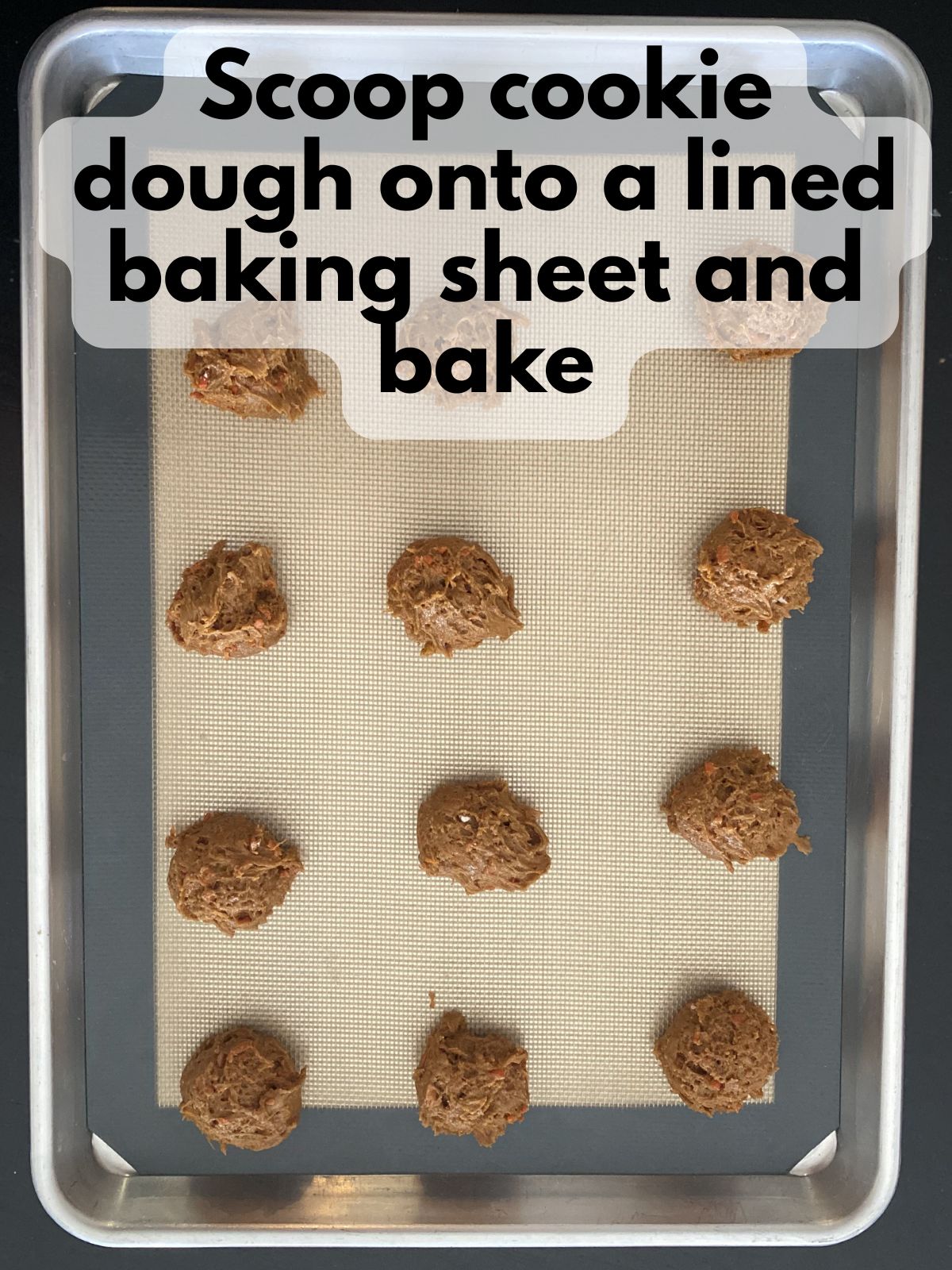 carrot cake cake mix dough scooped on a lined baking sheet