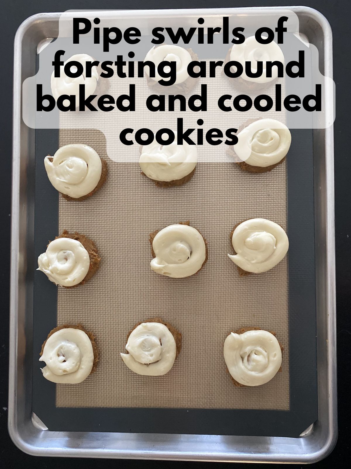 cream cheese frosting piped on top of carrot cake cake mix cookies