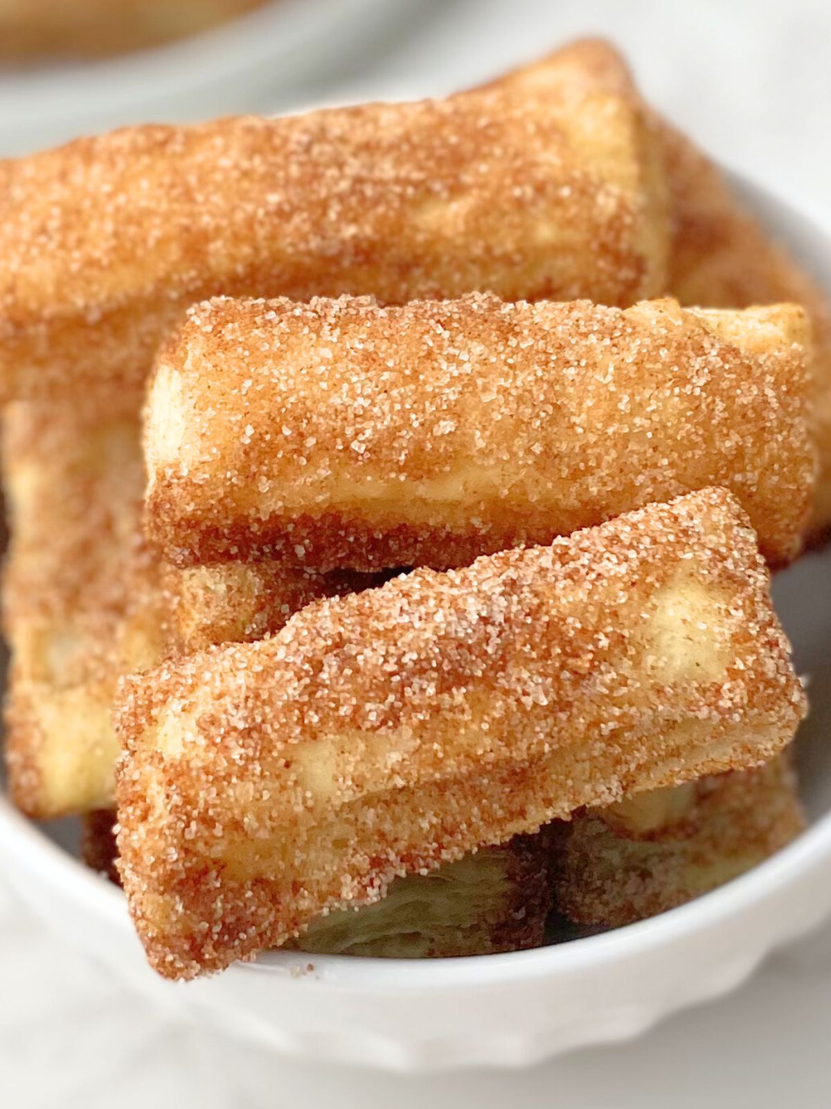 air fryer churro bites on a plate