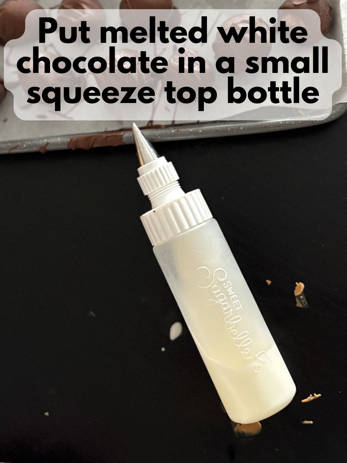 melted white chocolate in a squeeze bottle