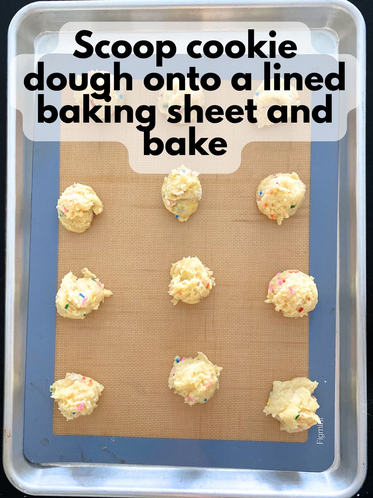 funfetti cookie dough scooped on a lined baking sheet