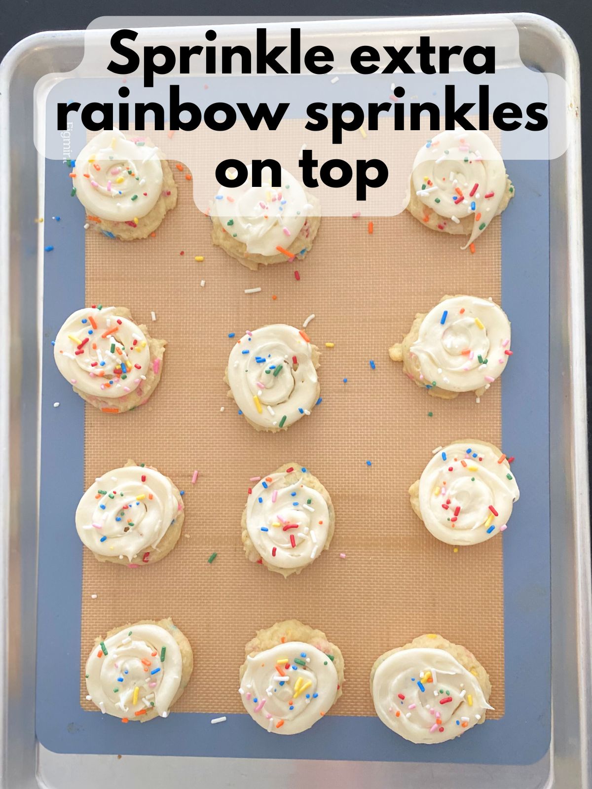 extra sprinkles sprinkled on top of frosted funfetti cookies