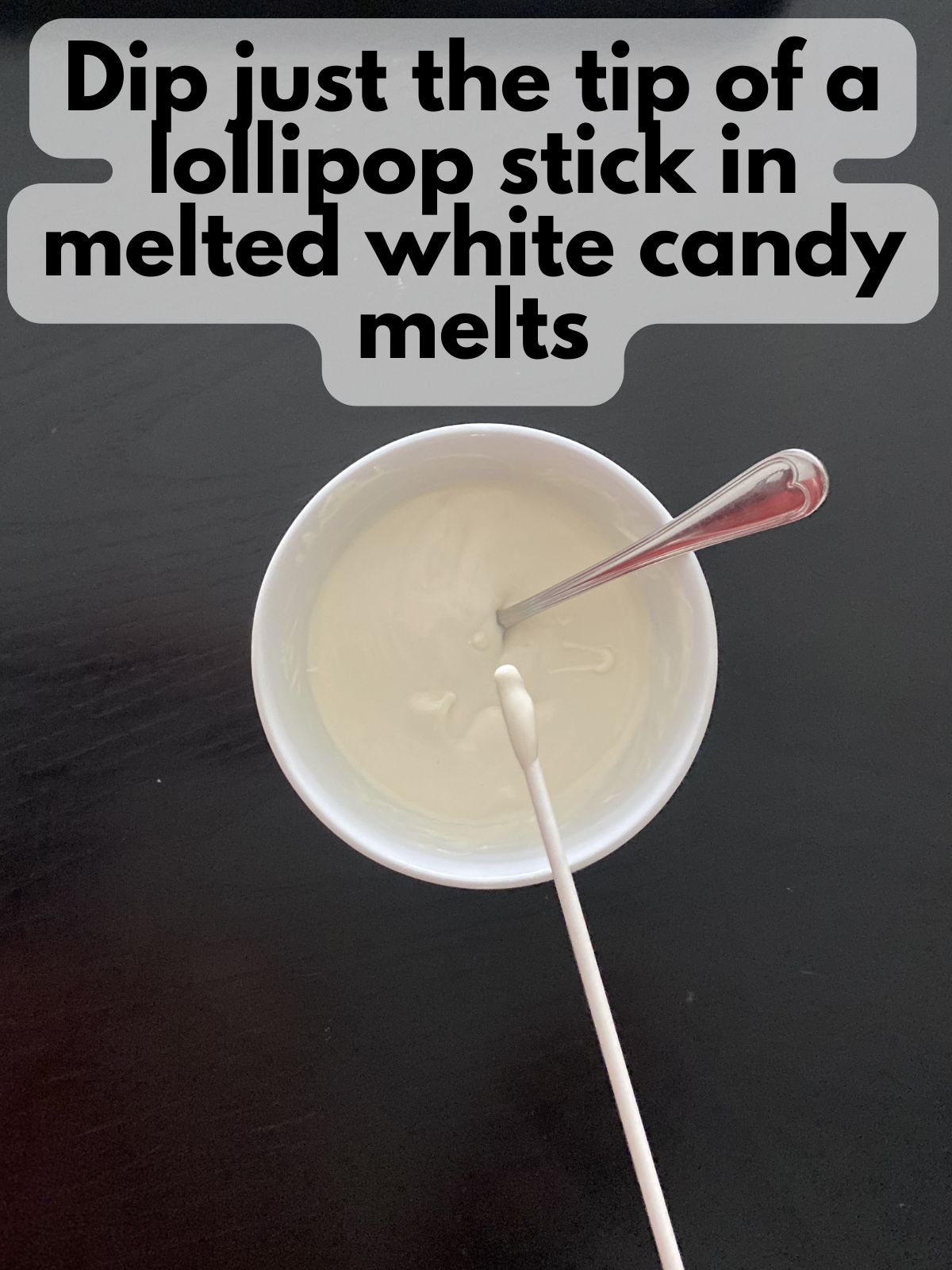 lollipop stick with the end dipped in melted white chocolate