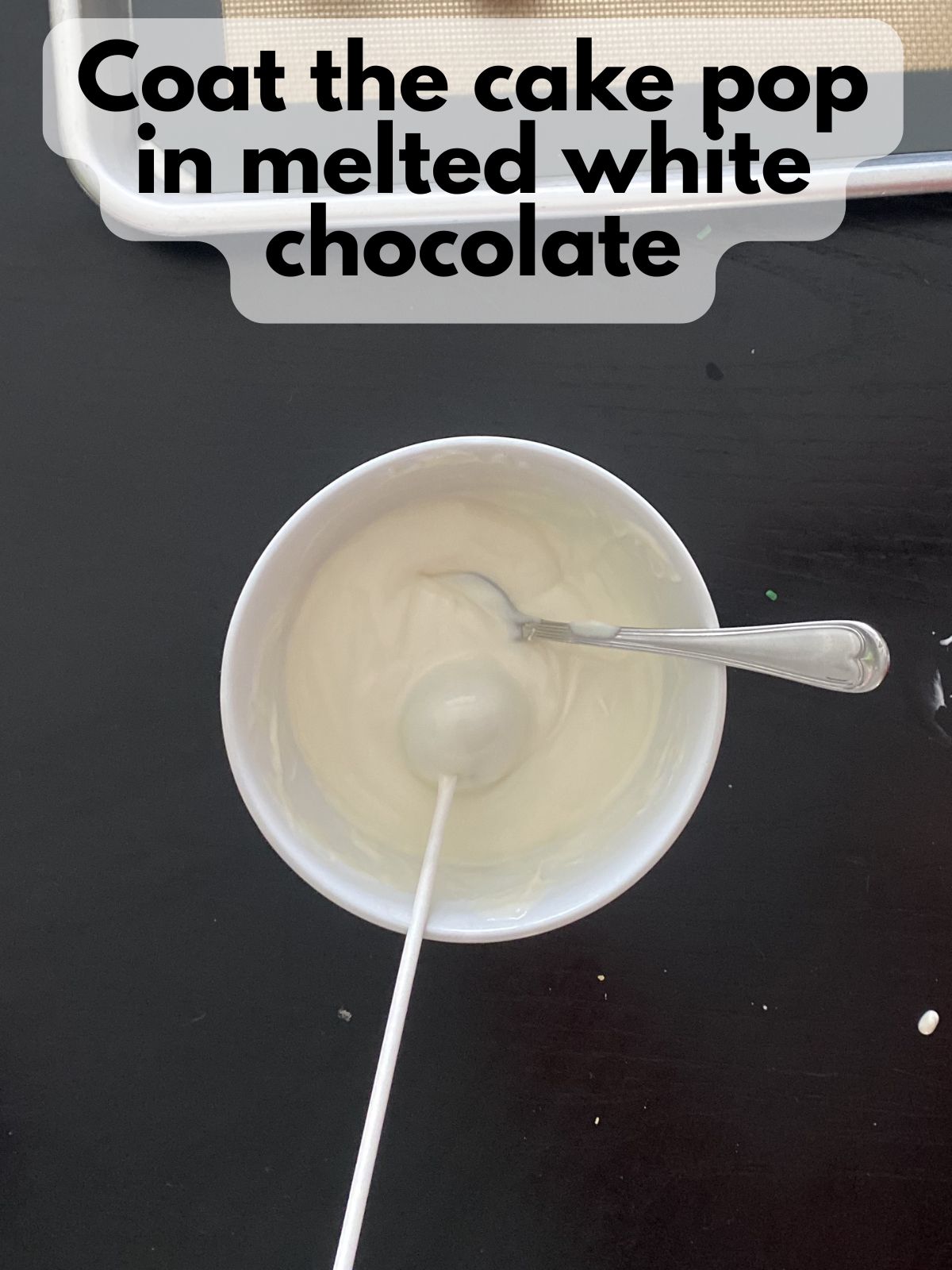 funfetti cake pop coated in melted white chocolate