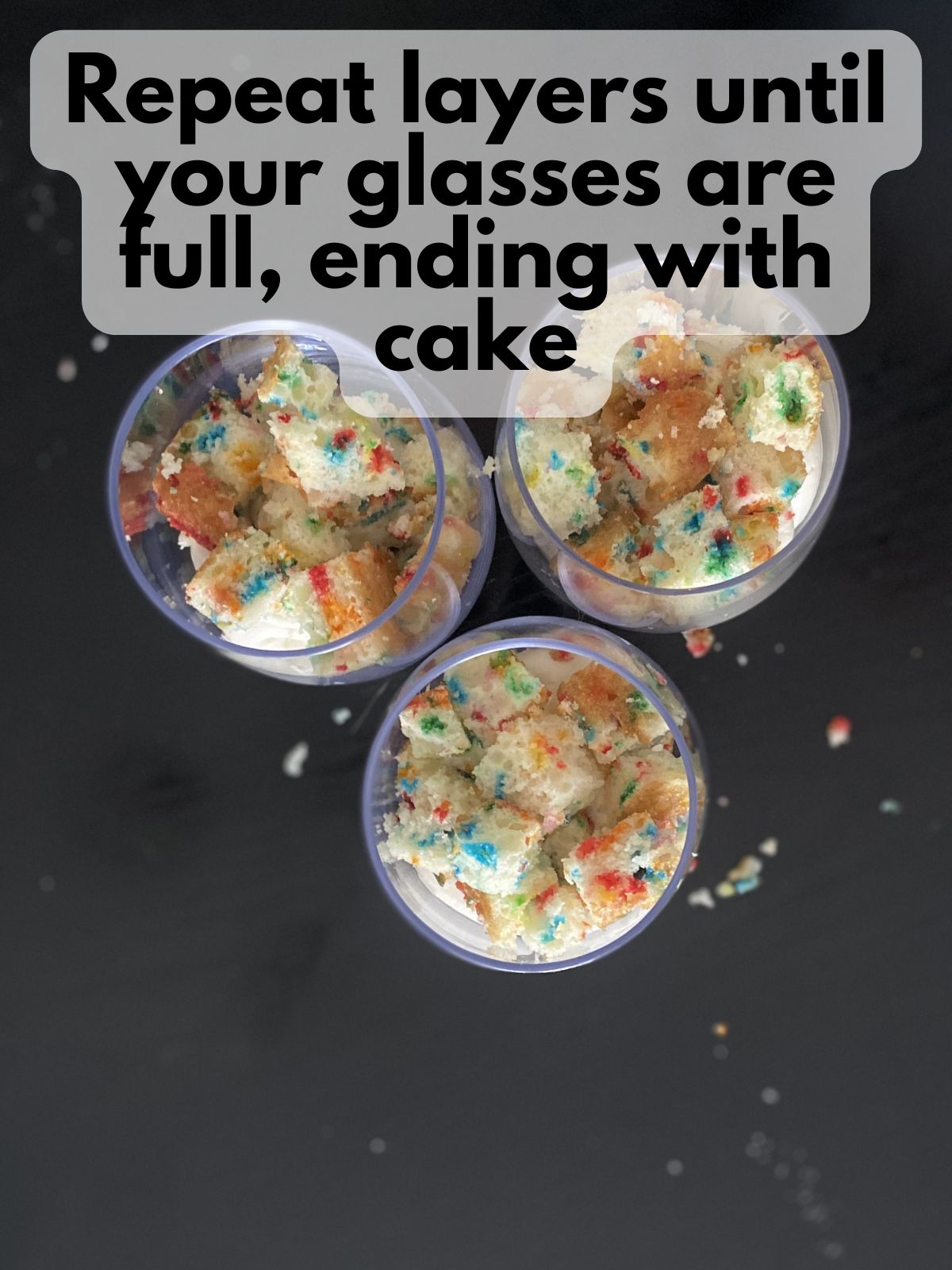 parfait cups filled with cake and cream cheese filling layers