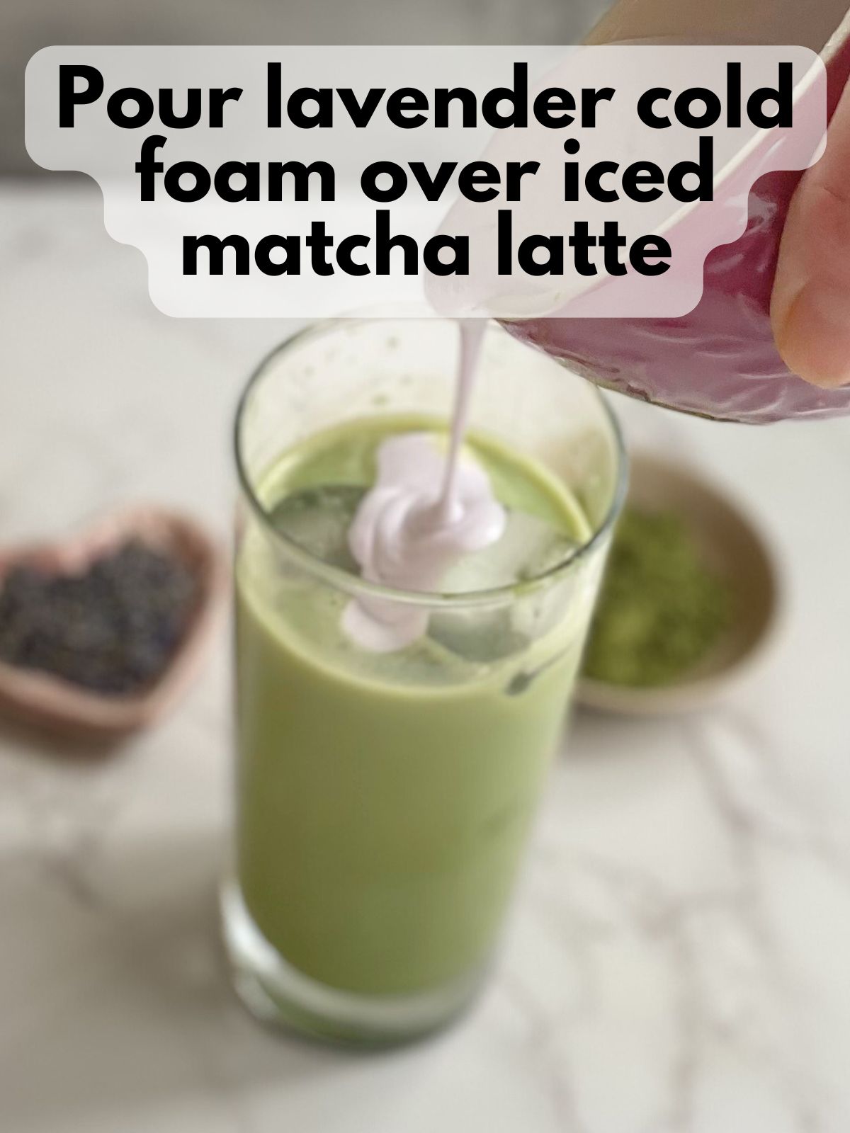 lavender cold foam poured over iced matcha latte