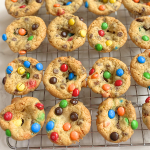 mini M&M cookie cups on a cooling rack