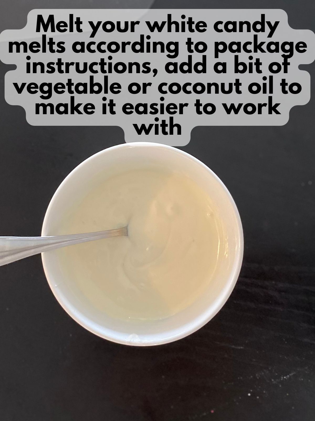 melted white candy melts mixed with a bit of coconut oil in a bol