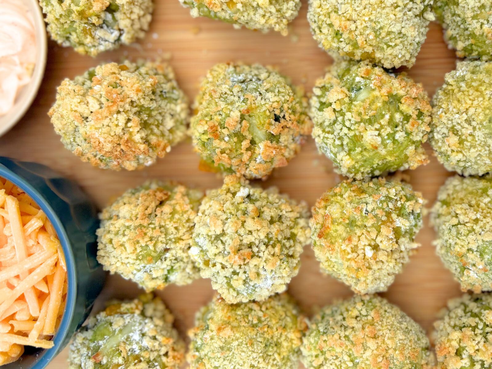 air fryer avocado and cheese fritters on a tray
