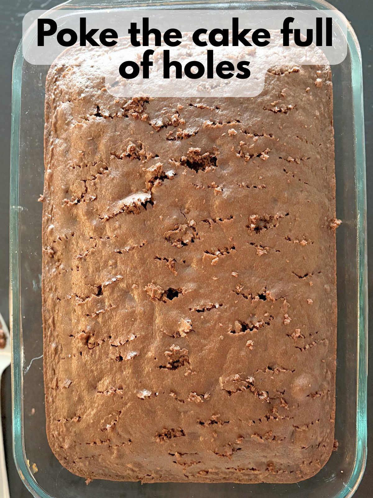 chocolate cake with holes poked in it