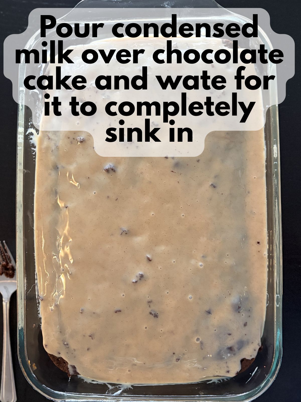 sweetened condensed milk spread over chocolate cake