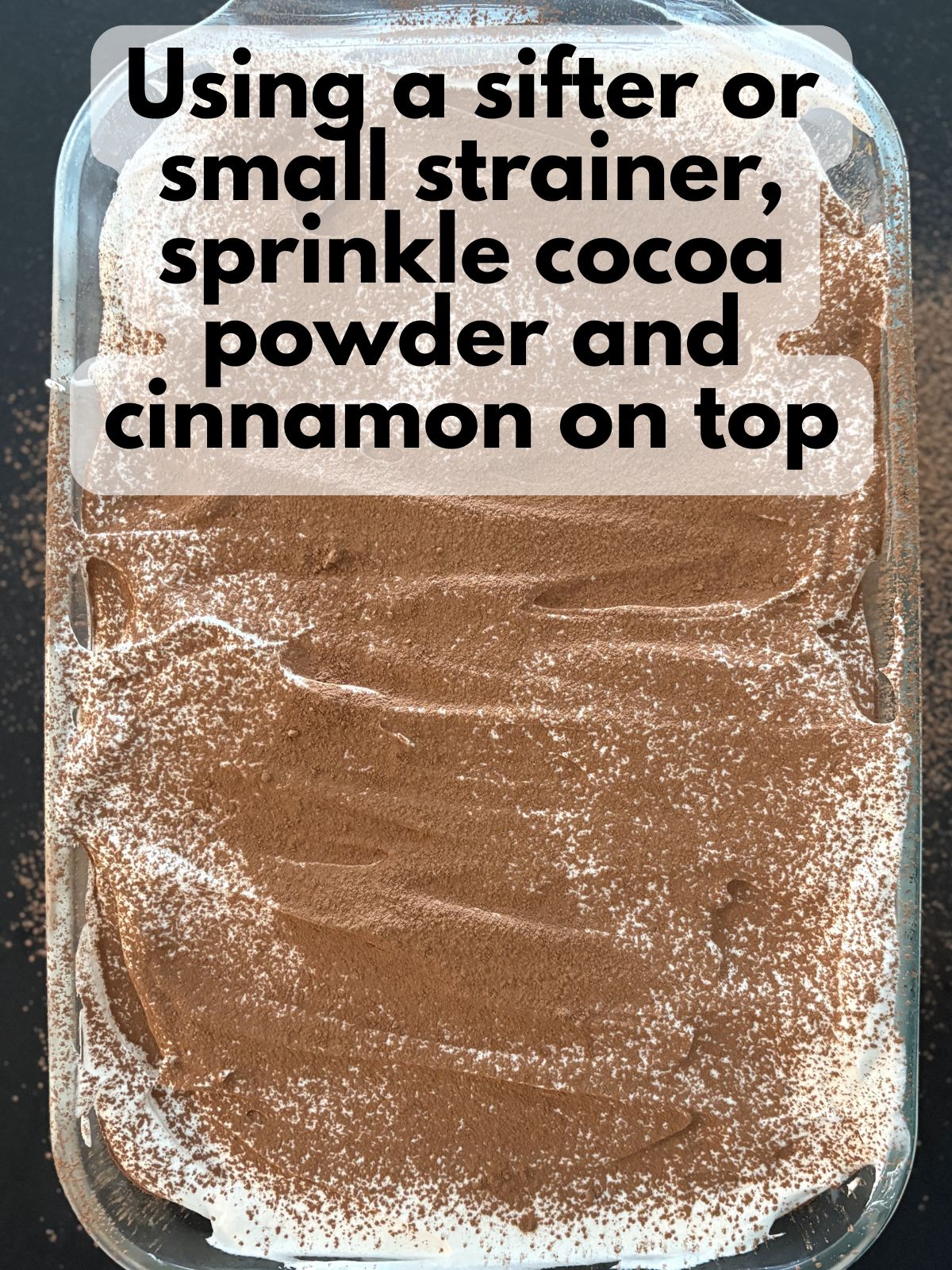 cinnamon and cocoa powder sprinkled on top of Cool Whip