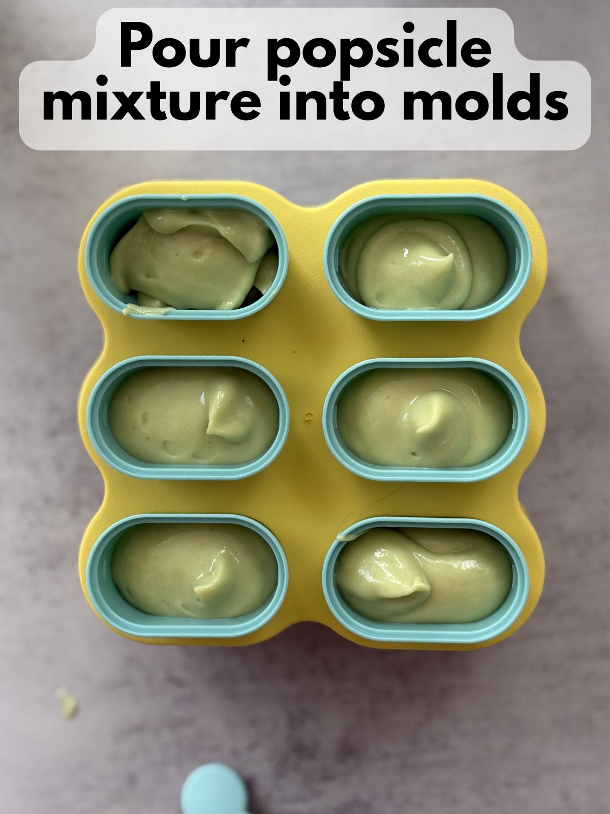 paleta mixture poured into a popsicle mold