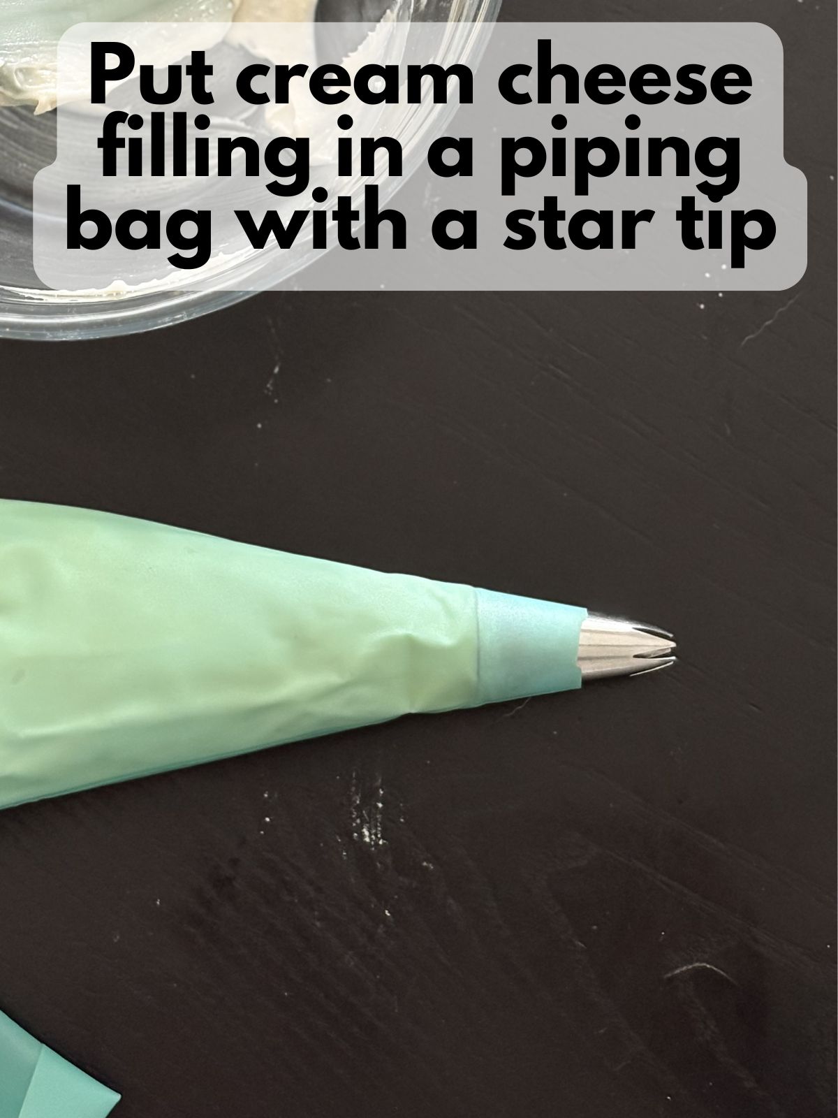 cream cheese filling in a piping bag with a star tip