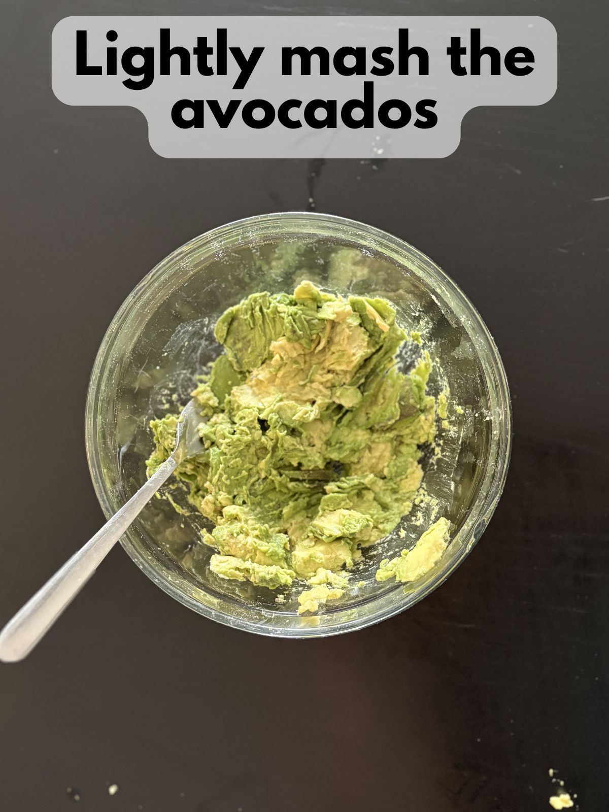 mashed avocado in a mixing bowl