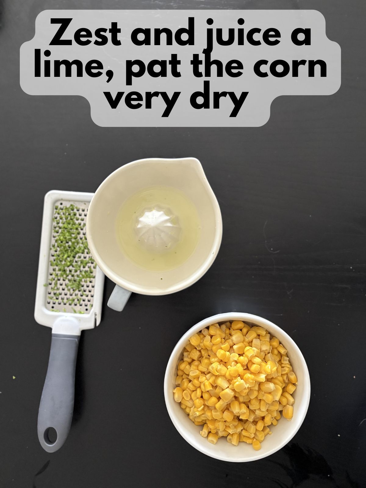 lime zest, lime juice and corn in a bowl