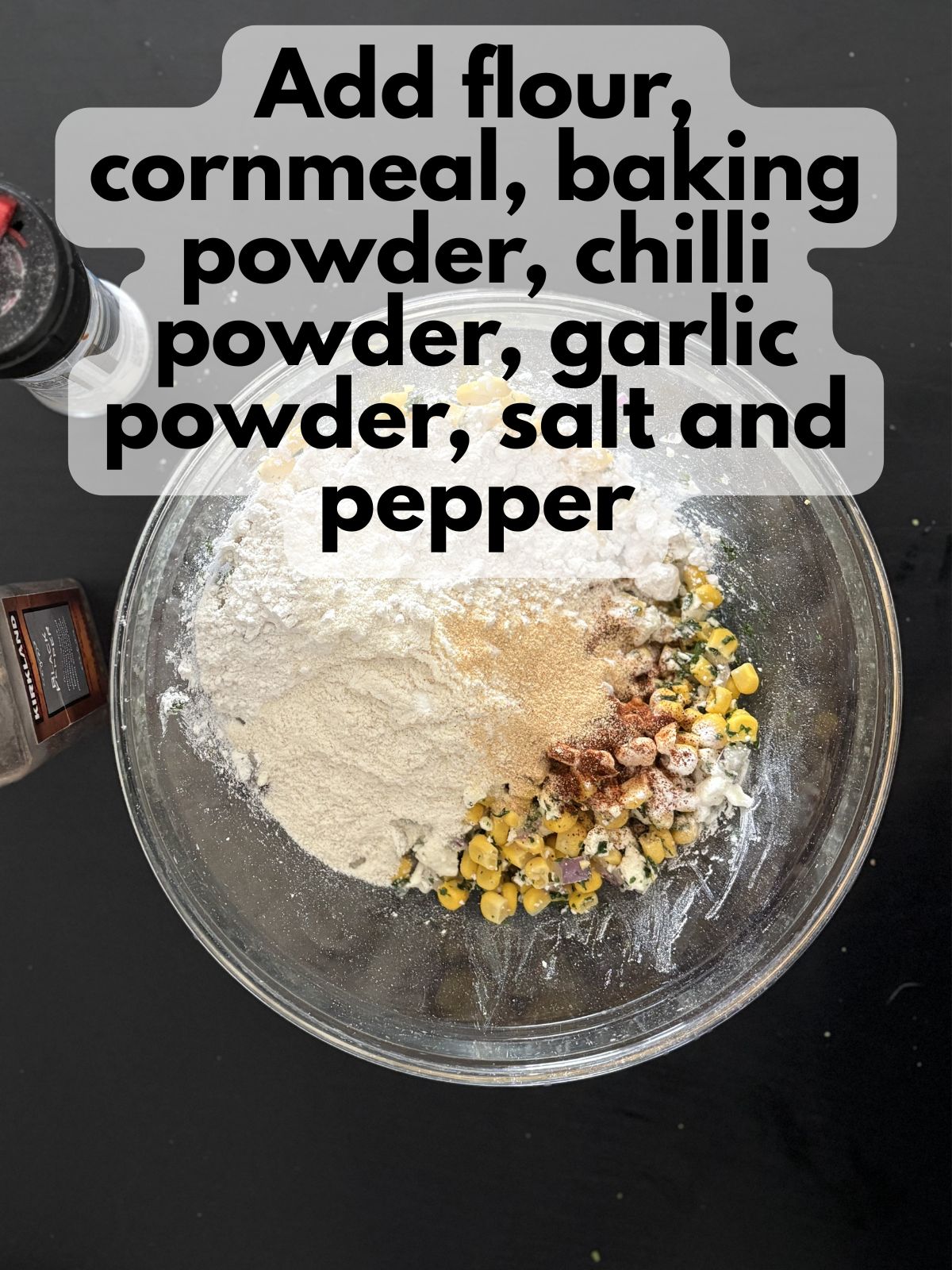 dry ingredients in a bowl on top of corn, cheese, onion and cilantro