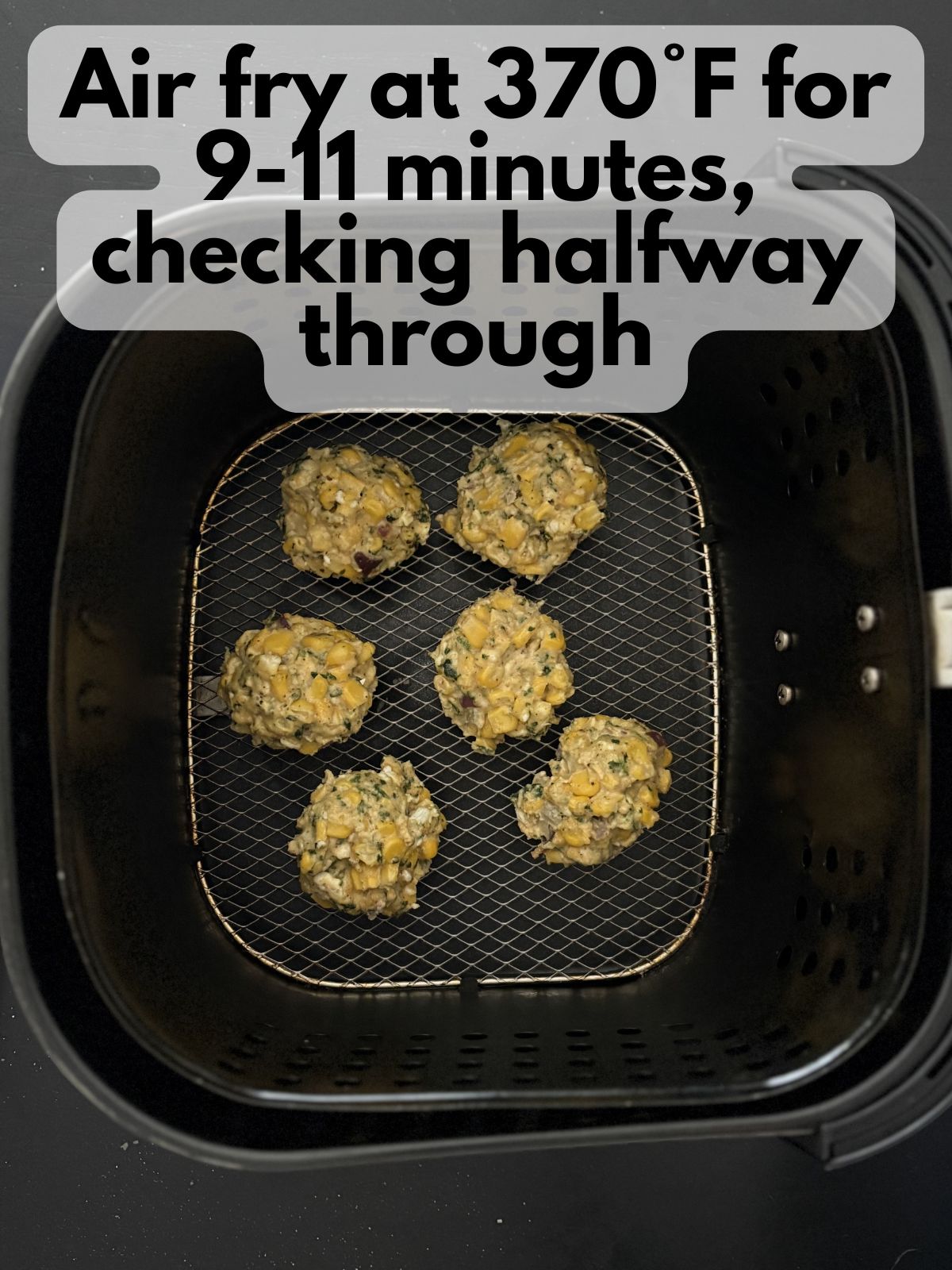 elote fritter batter in an air fryer basket
