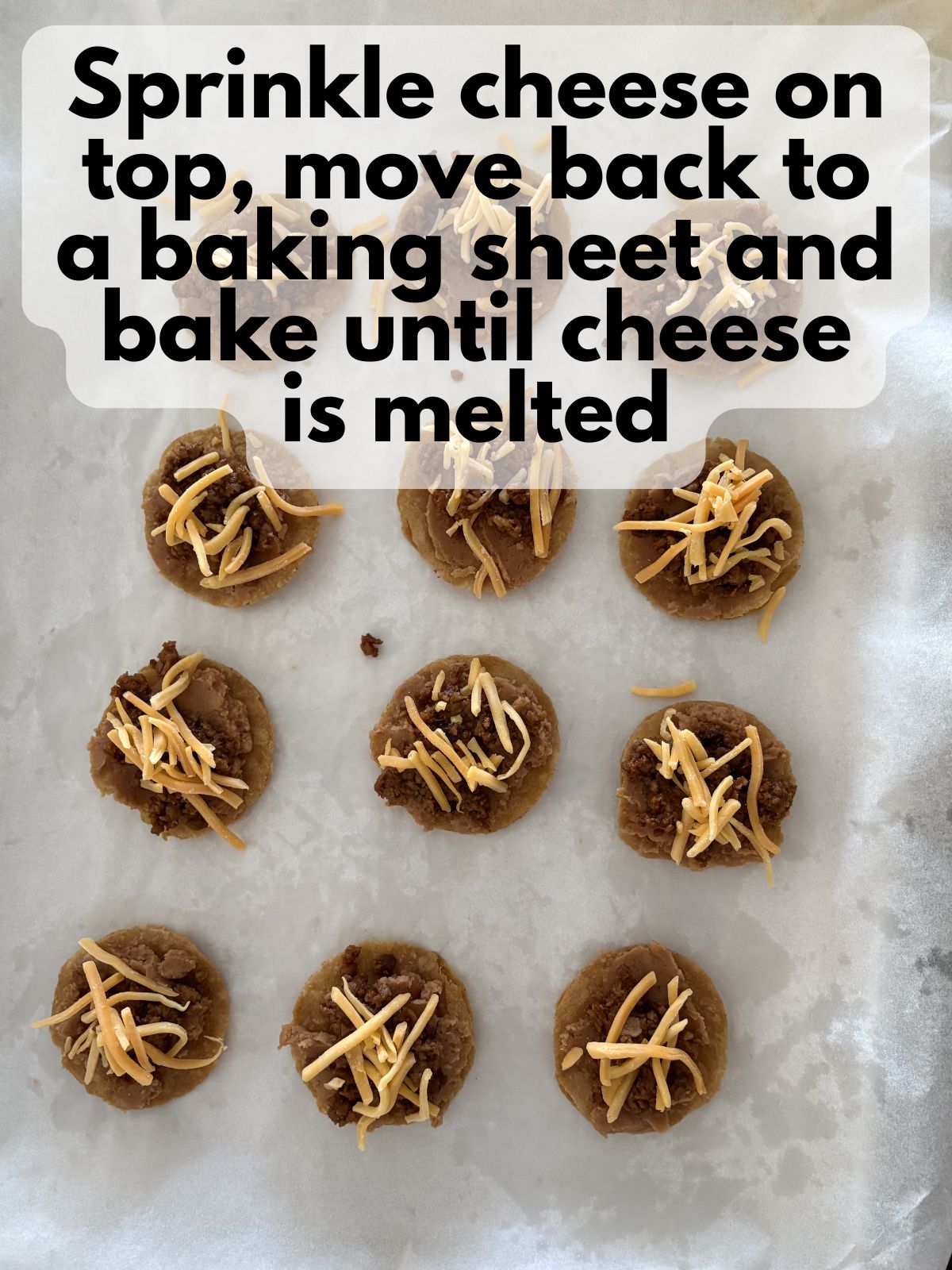 mini tostadas with cheese sprinkled on top