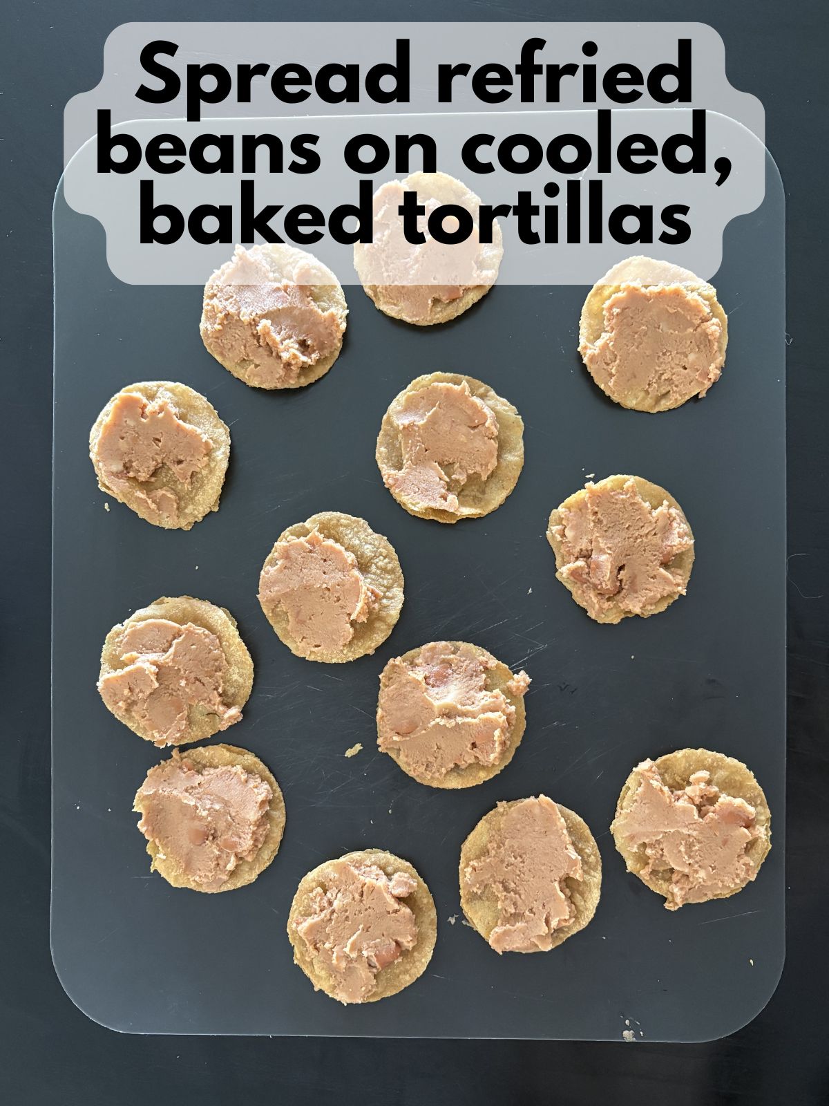refried beans spread on mini tortillas