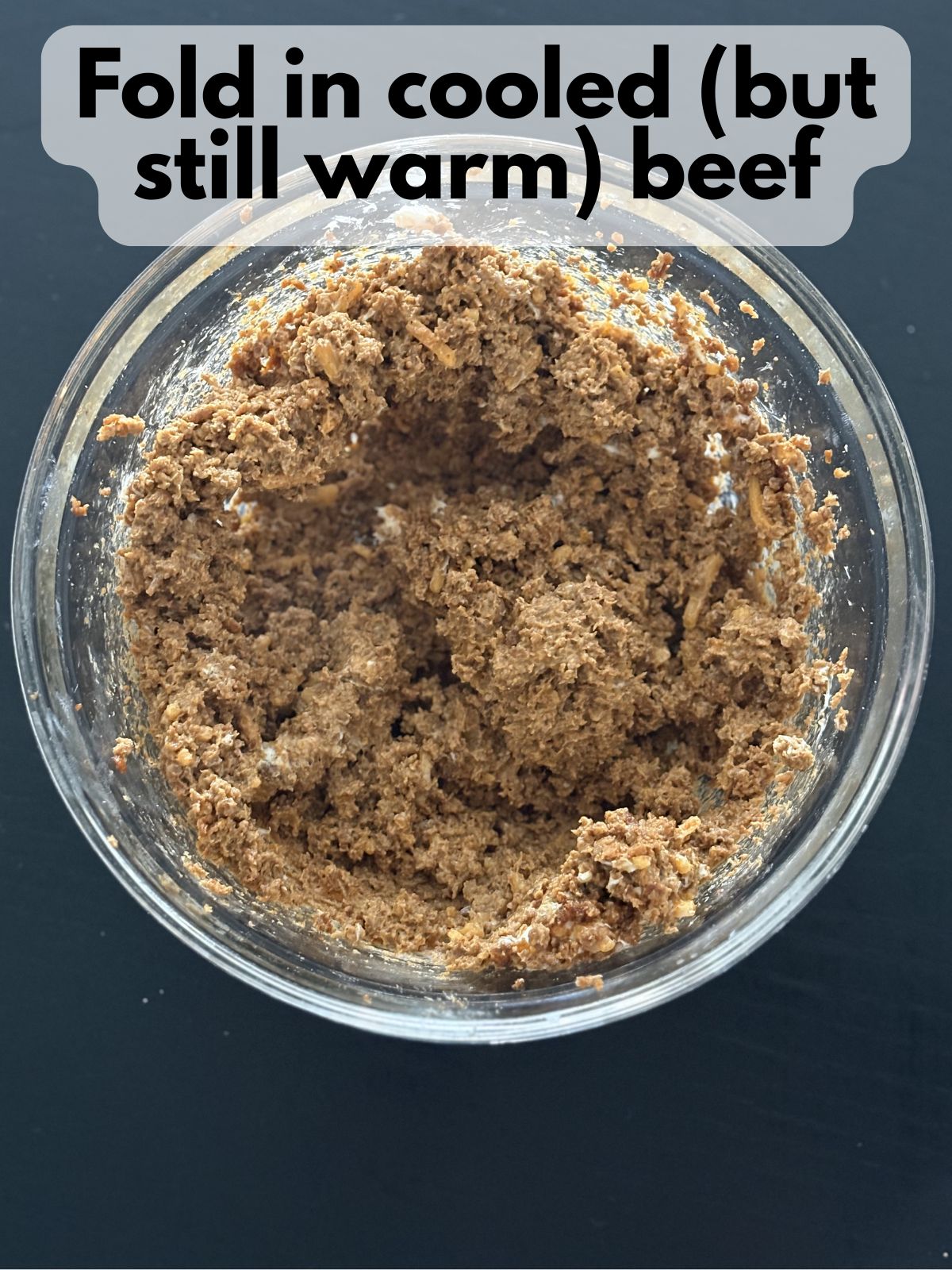 taco meat mixed in with cream cheese and cheese