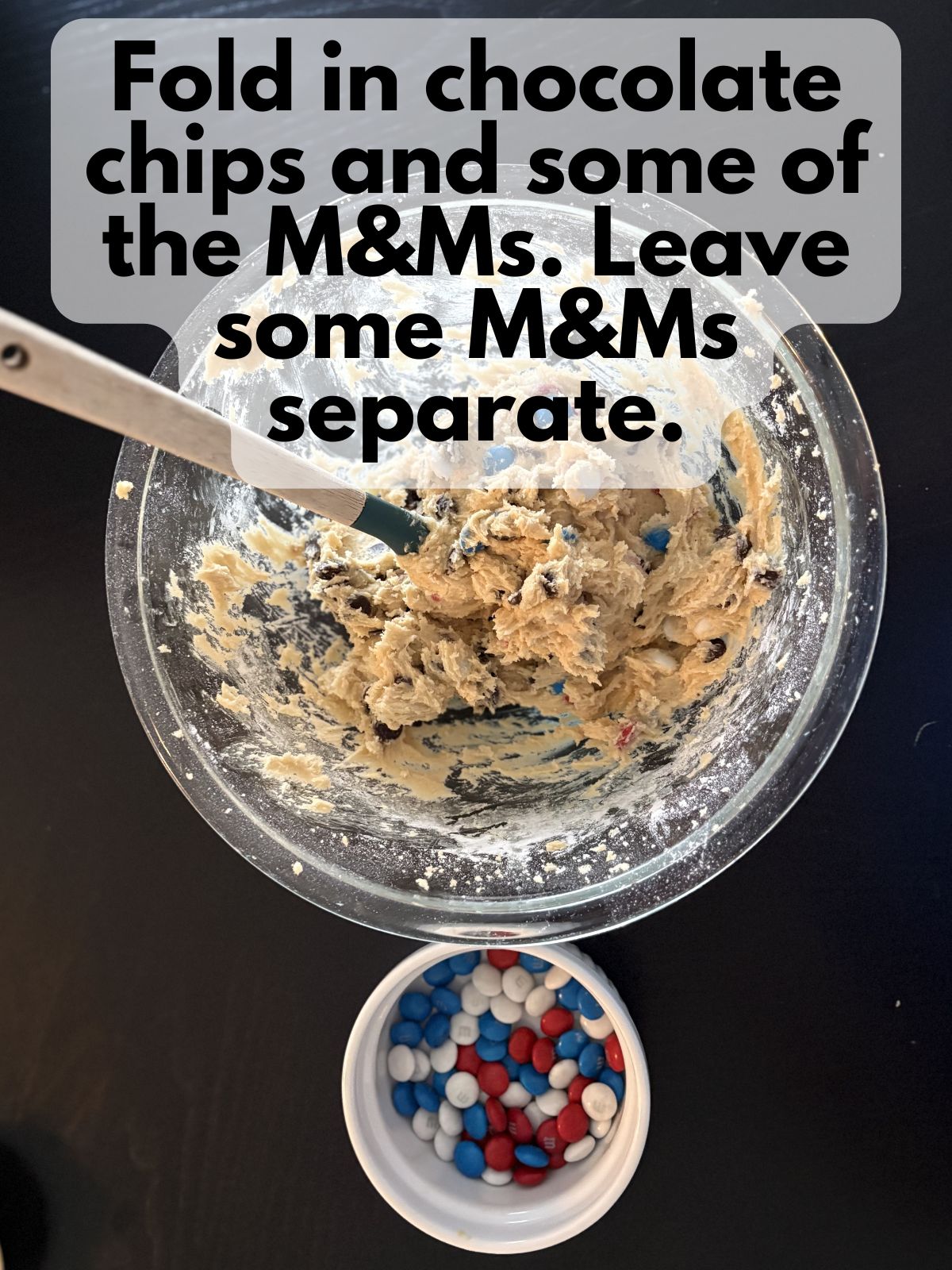 M&M's folded into cookie bar dough, some M&Ms left apart