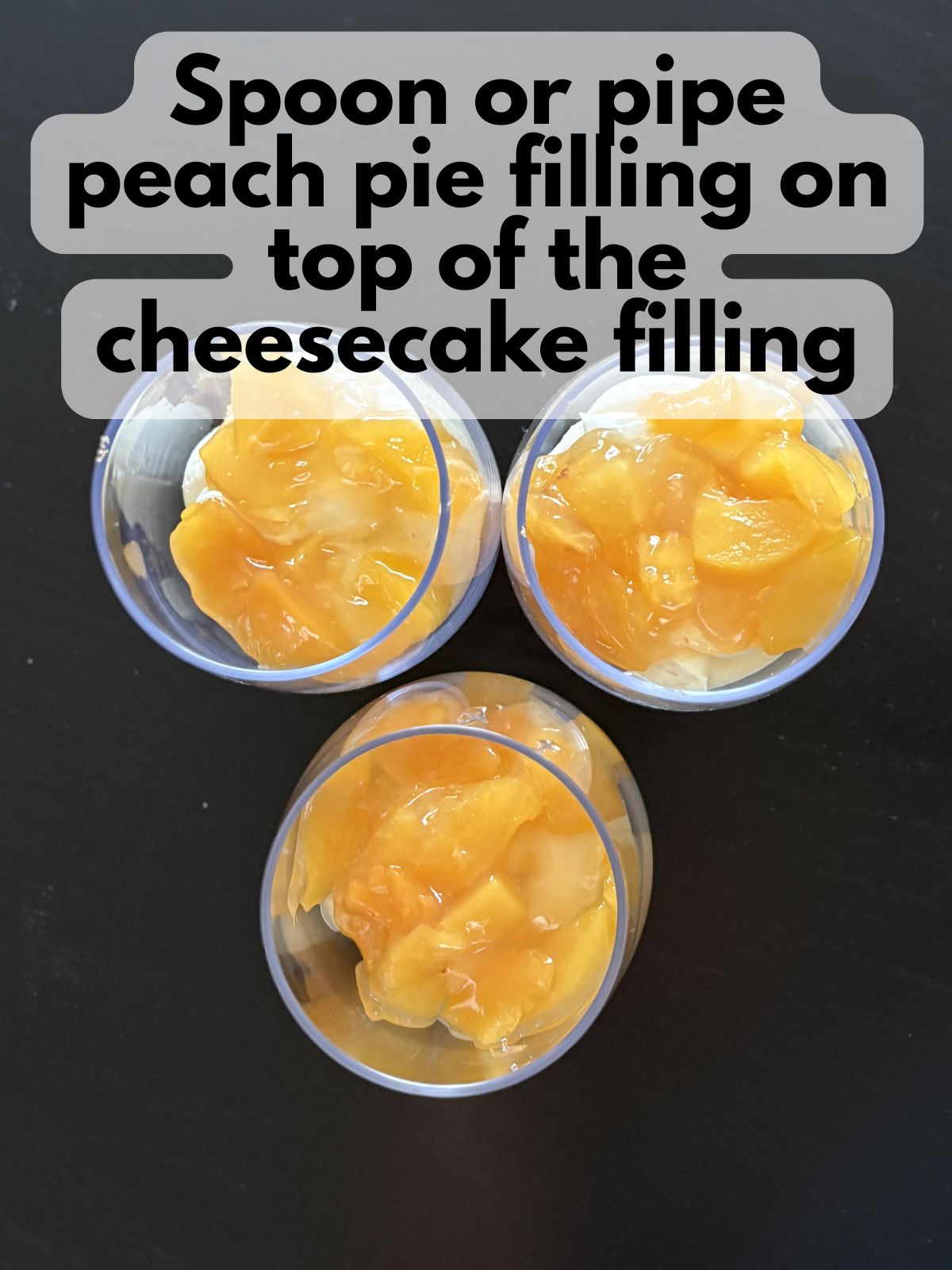 peaches layered on top of cheesecake layer