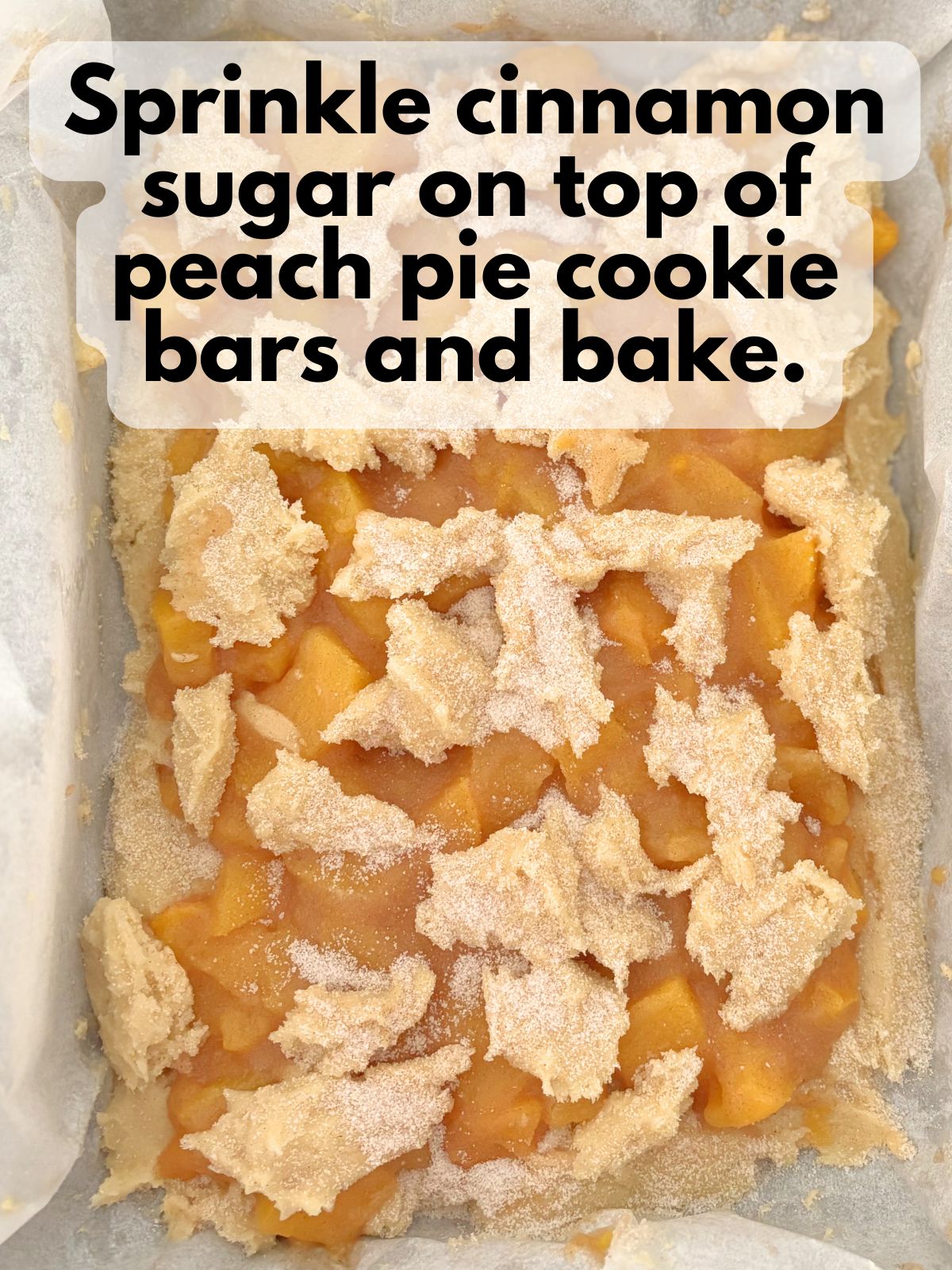 cinnamon sugar sprinkled on top of peach pie bars